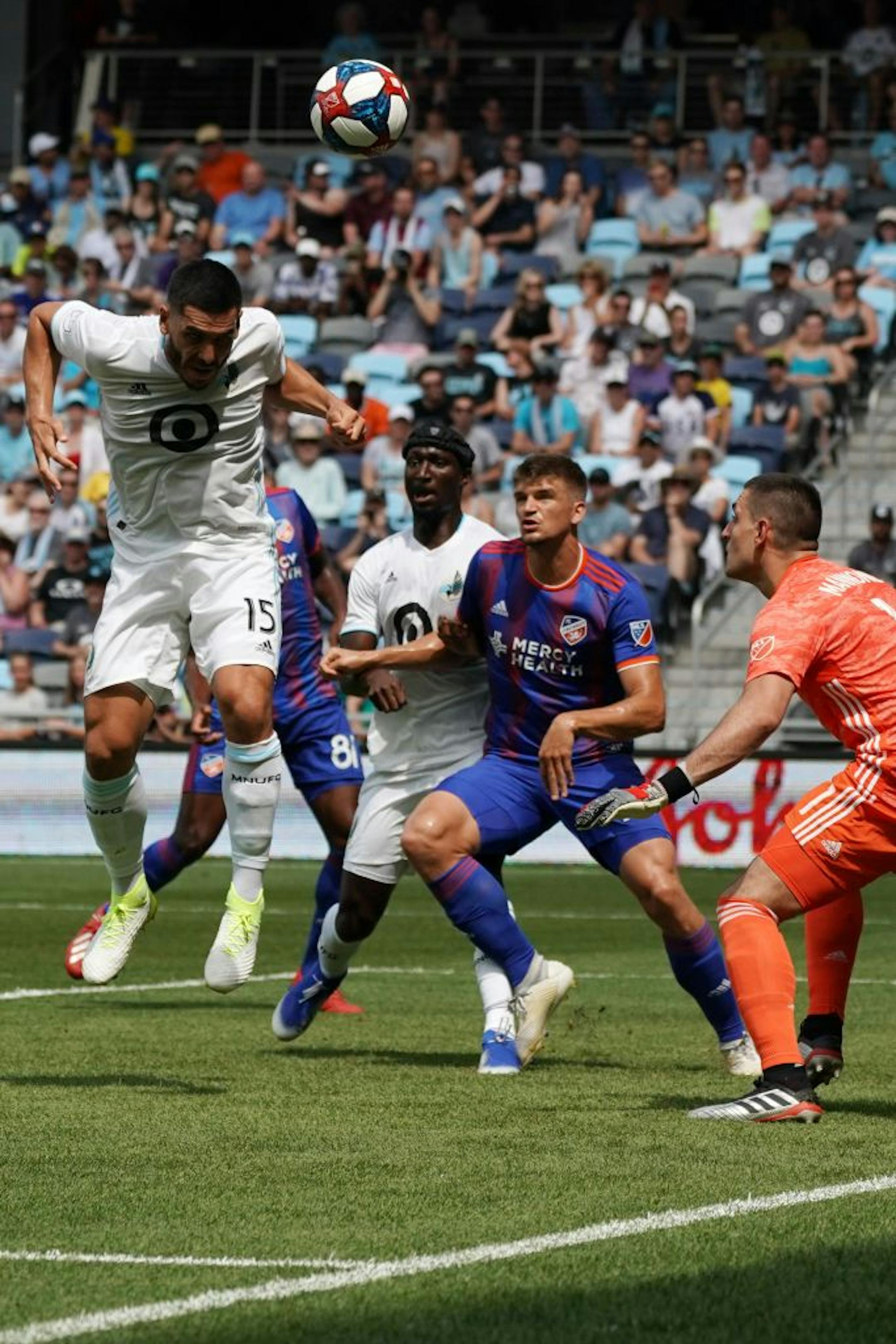 Minnesota United defender Michael Boxall (15) headed the ball out away from Minnesota United goalkeeper Vito Mannone (1) in the first half.