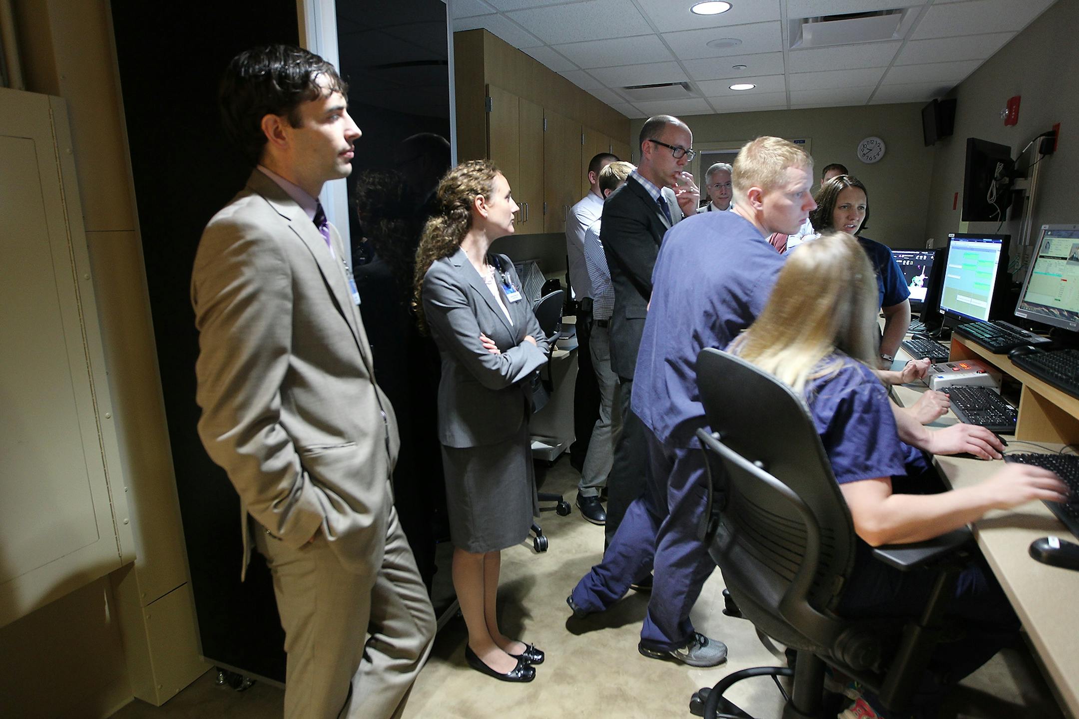 Mayo Clinic staff including doctors, physicists, and radiation technicians, jammed a room as patient Ashely Sullivan was the first to receive proton beam therapy, Monday, June 22, 2015 at Mayo Clinic in Rochester, MN.