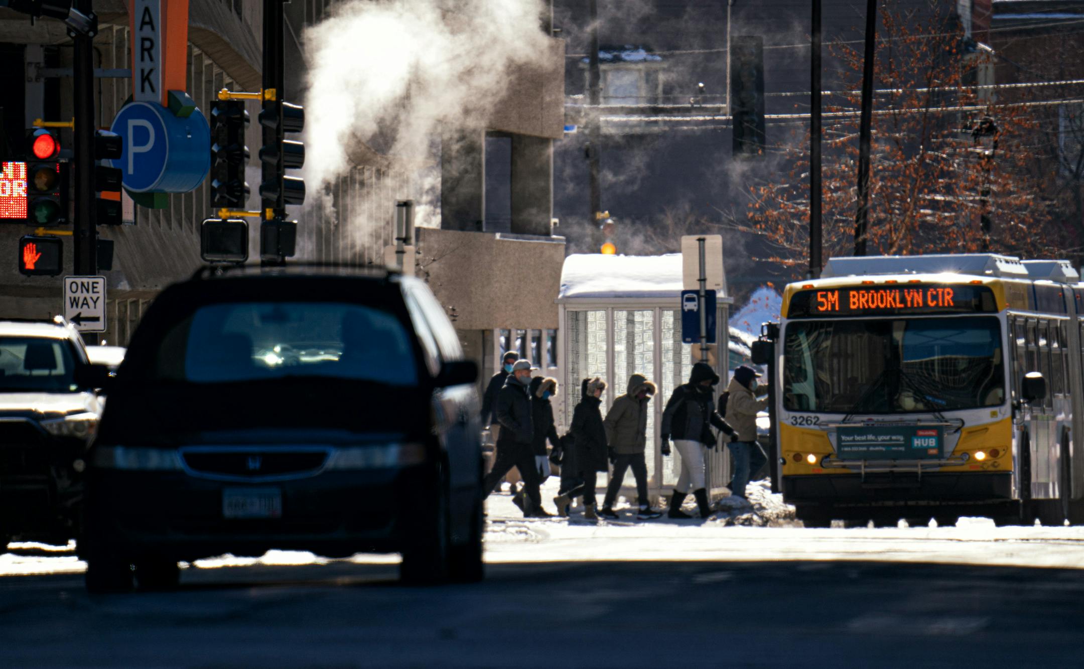 Bright sunshine and calm winds kept Twin Cities' below zero temperatures from being too awful.These folks crossed Chicago Ave at 8th St Monday afternoon as the temperature registered five below zero.