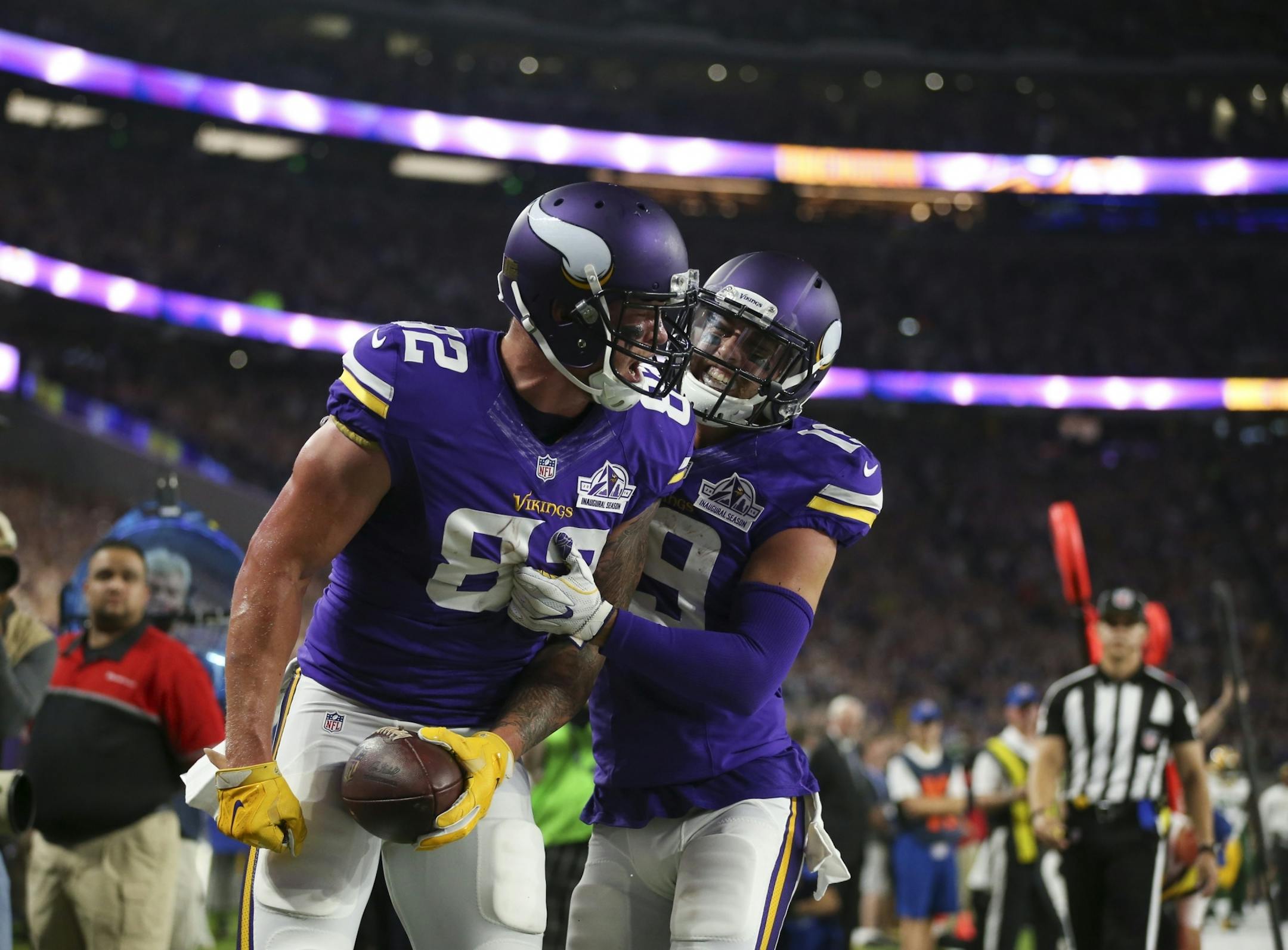 Vikings tight end Kyle Rudolph (82) was congratulated by teammate Vikings wide receiver Adam Thielen (19) after his second quarter touchdown.