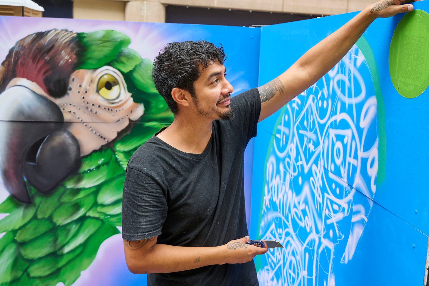 An artist at the 2023 Downtown Minneapolis Street Art Festival on August 13, 2023 in Minneapolis, Minnesota.