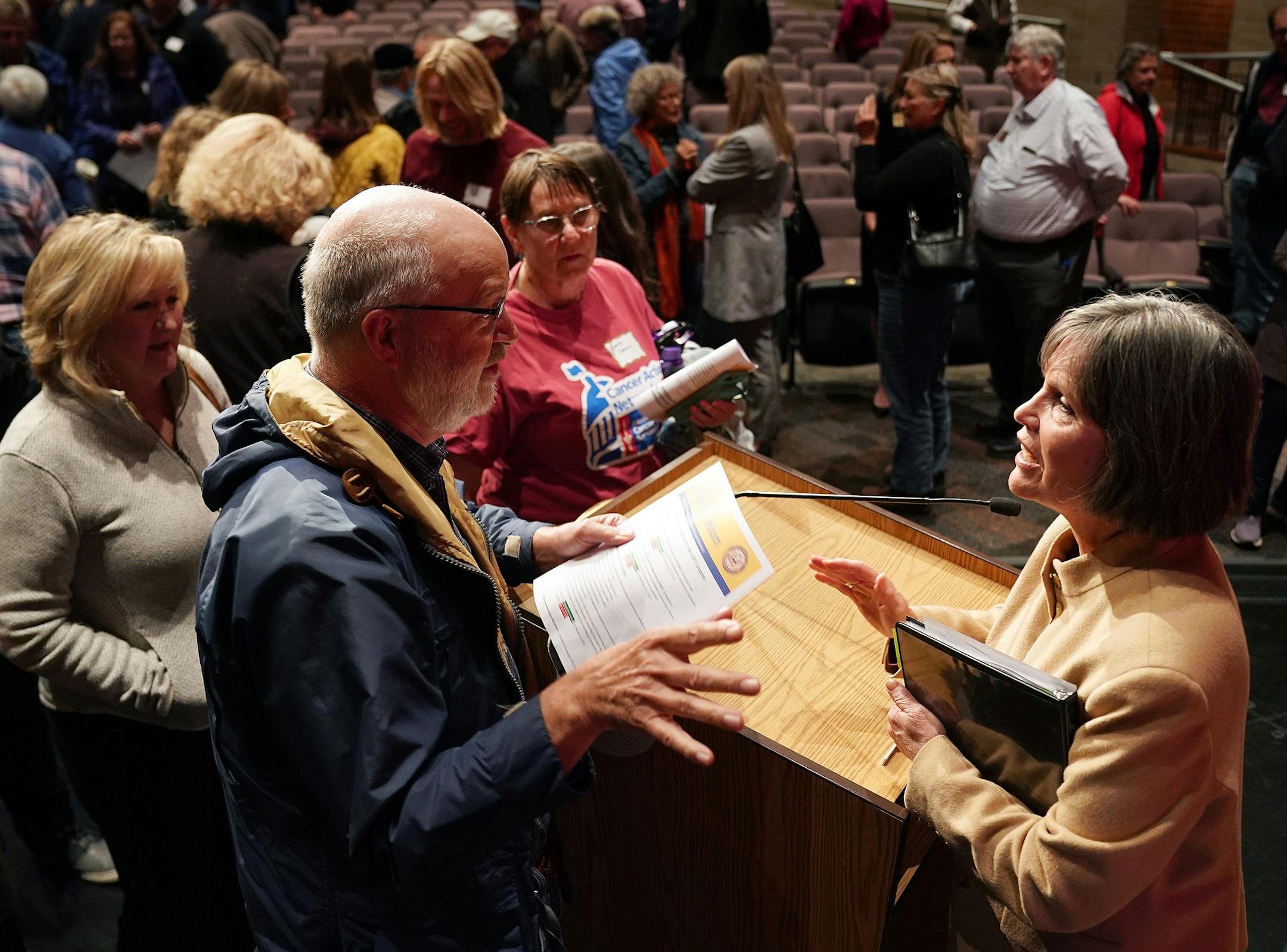 A supporter of the impeachment inquiry spoke with U.S. Rep. Betty McCollum following a town hall meeting in Stillwater on Thursday, Oct. 3. Those opposed also had plenty to say.