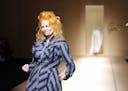 British designer Vivienne Westwood acknowledges the public at the end of Spring/Summer 2008 ready-to-wear collection show in Paris, 01 October 2007. A