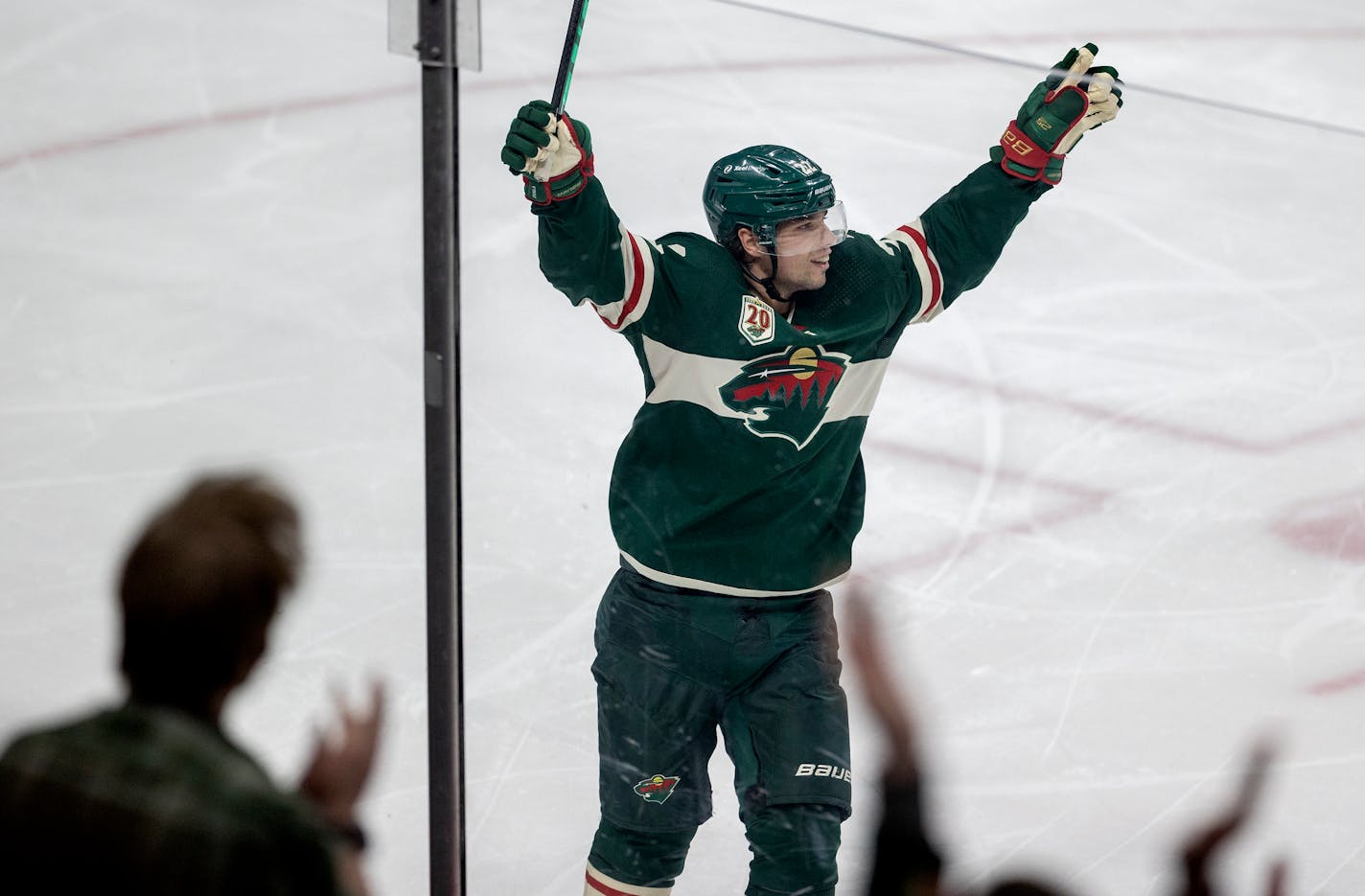 Kevin Fiala (22) of the Minnesota Wild celebrated a goal in the third period. Fiala had a hat trick in the game.