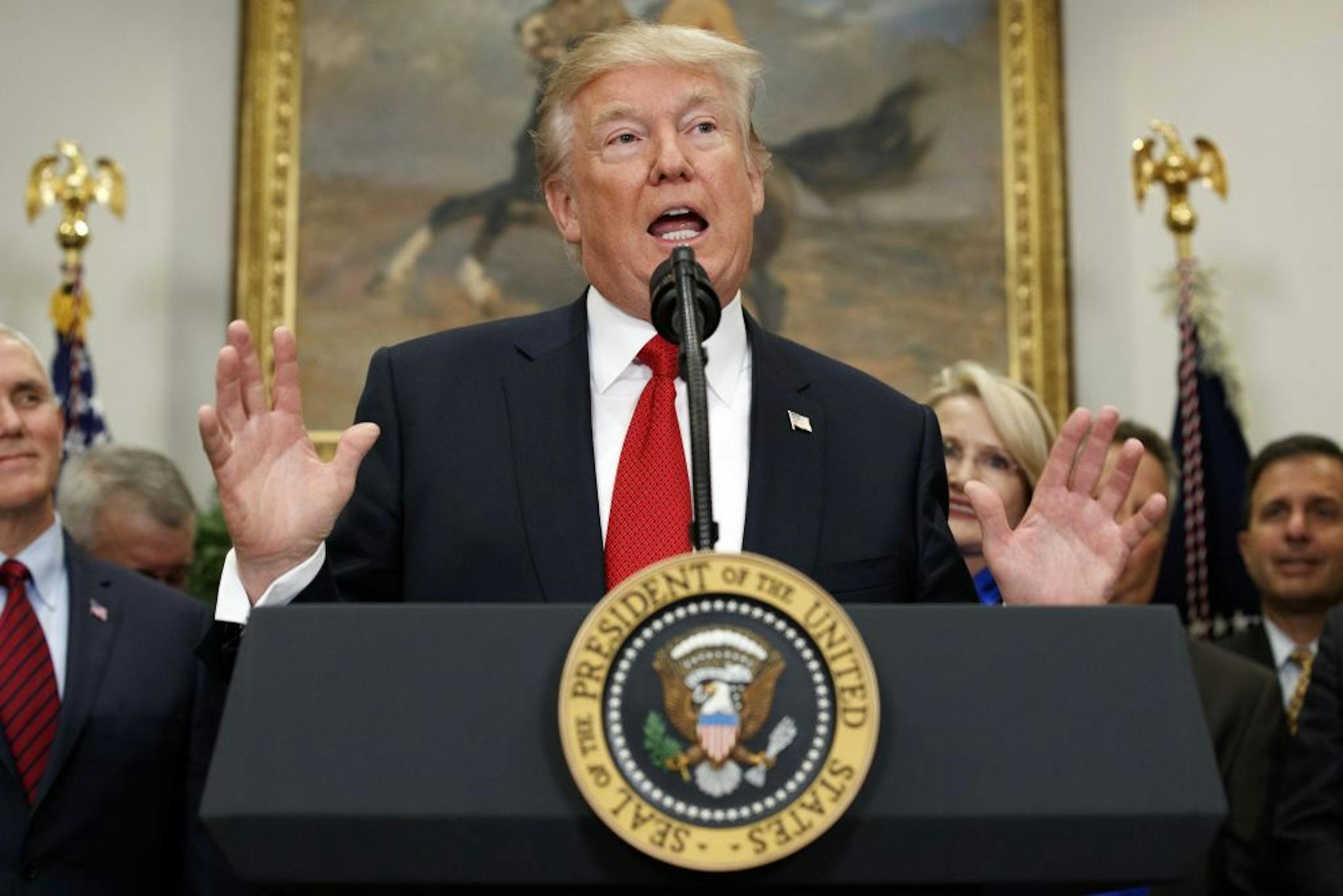President Donald Trump speaks before signing an executive order on health care Thursday at the White House.