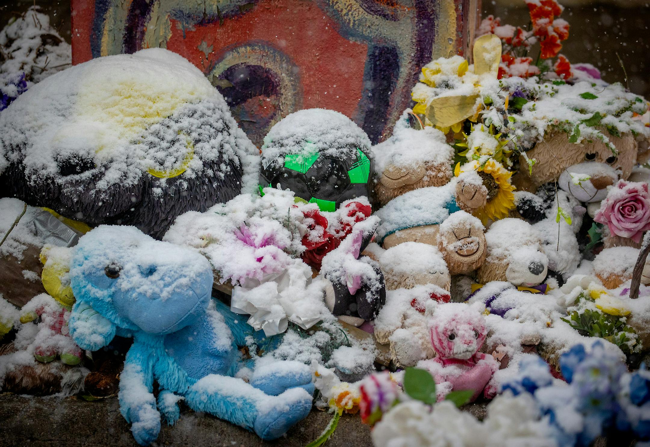 Stuffed animals and other tokens were covered in snow at the George Floyd memorial in Minneapolis. ] ELIZABETH FLORES • liz.flores@startribune.com