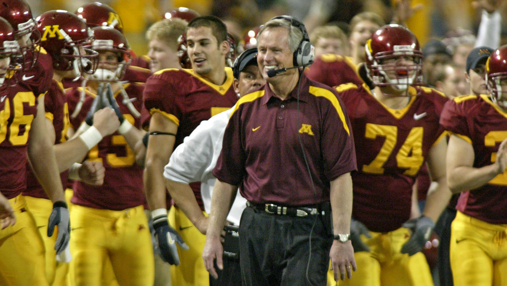 MARLIN LEVISON * mlevison@startribune.com 11/04/06 Assign# 105256 GENERAL INFORMATION: Gophers football vs. Indiana. Minnesota wins 63-26. IN THIS PHOTO: It was a happy Gophers head coach Glen Mason and team bench as the final seconds of the victory wound down.