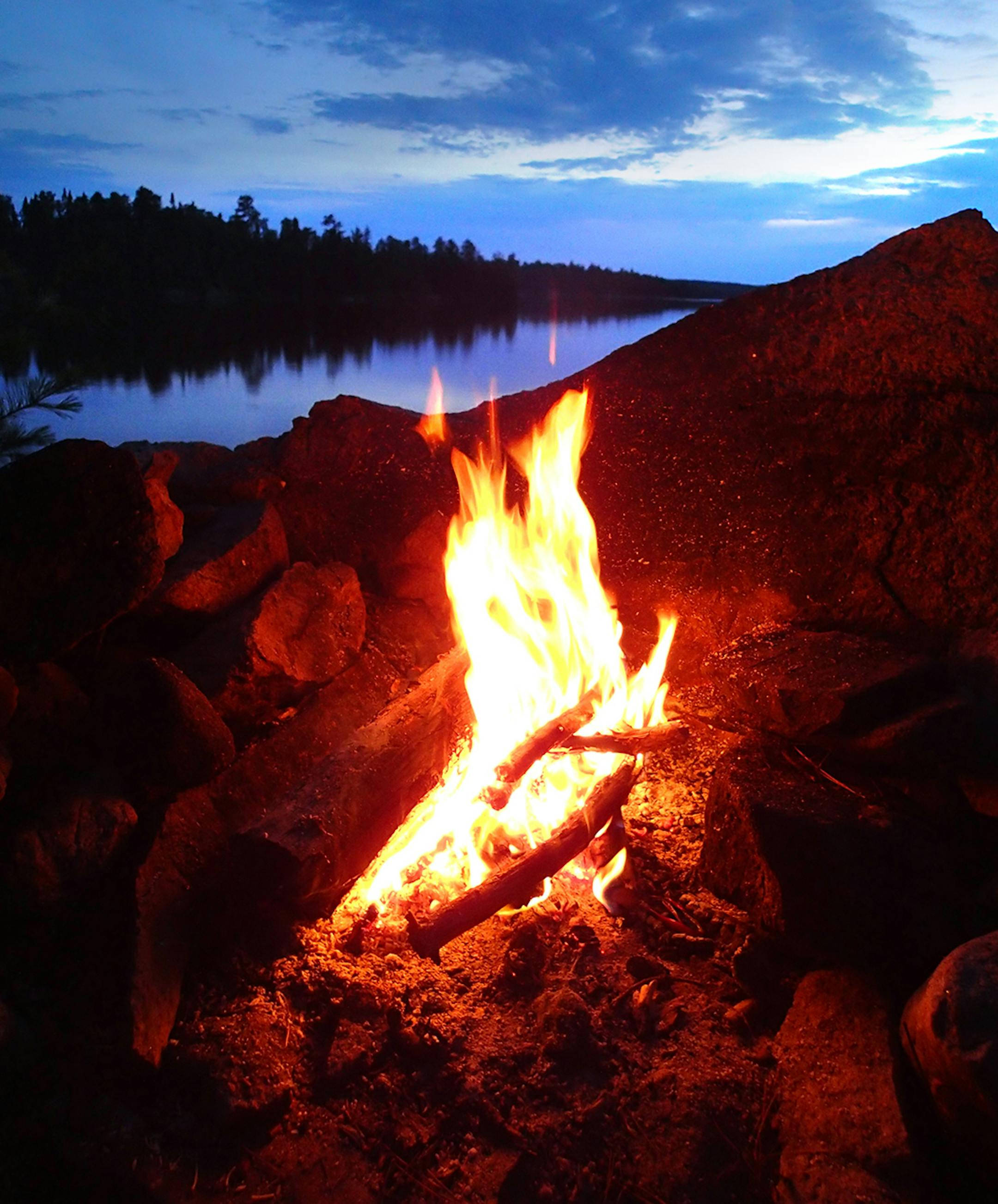 A campfire on a remote lake in Quetico Provincial Park in Ontario.