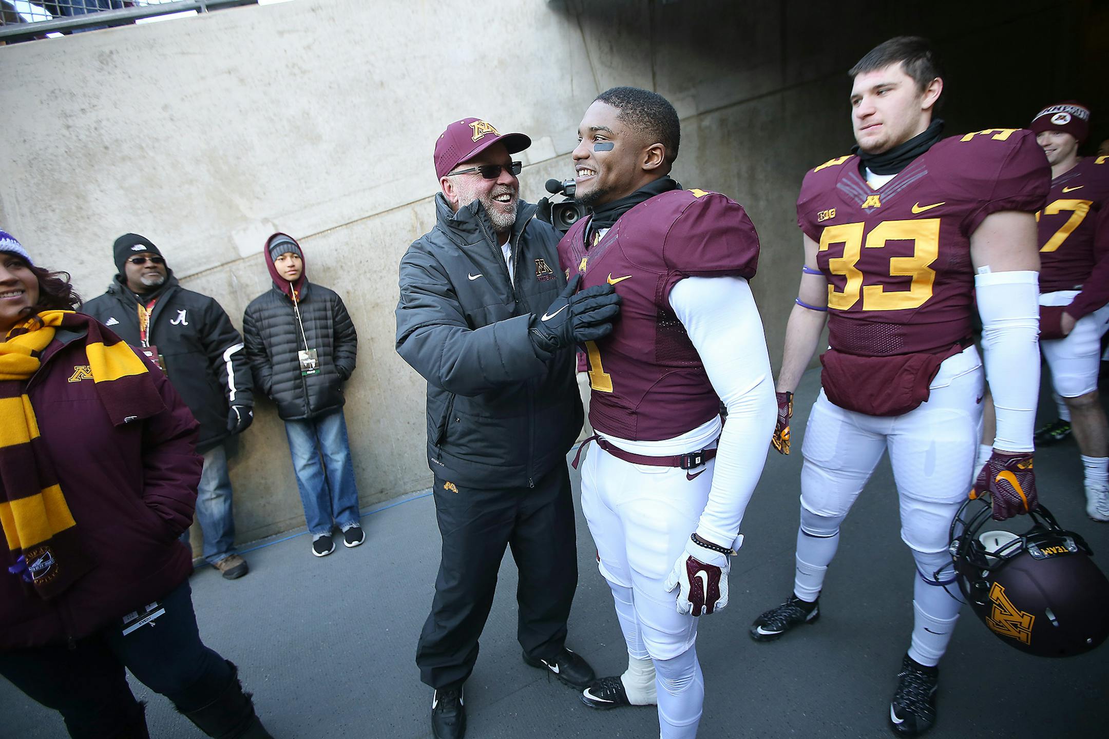 Former Minnesota Head Coach Jerry Kill greeted senior players including Minnesota's wide receiver KJ Maye before the Minnesota Gophers took on the Wisconsin Badgers at TCF Bank Stadium, Saturday, November 28, 2015 in Minneapolis, MN. ] (ELIZABETH FLORES/STAR TRIBUNE) ELIZABETH FLORES &#x2022; eflores@startribune.com