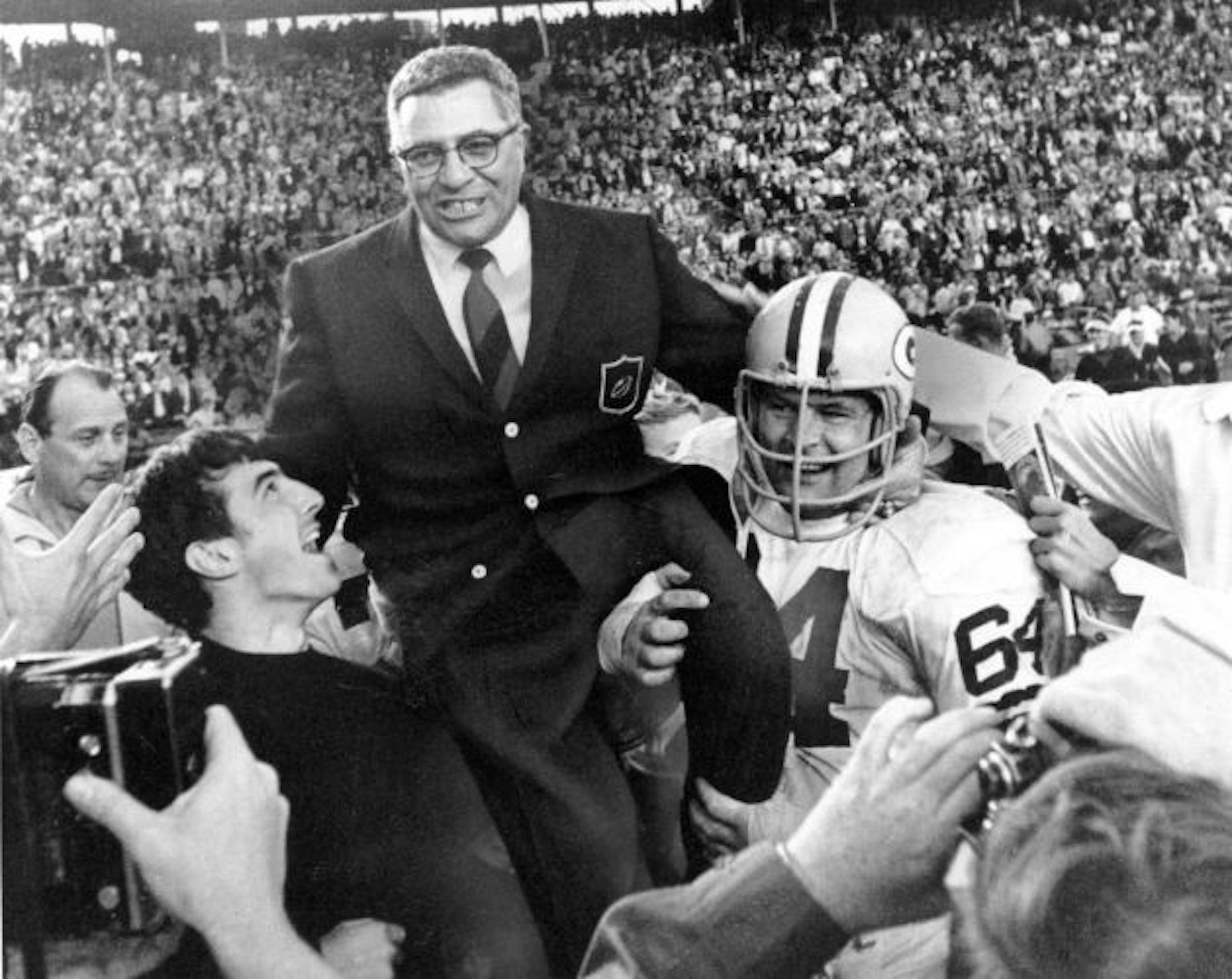 This Jan. 14, 1968 file photo shows Green Bay Packers coach Vince Lombardi being carried off the field after his team defeated the Oakland Raiders 33-14 in Super Bowl II in Miami, Fla. Packers guard Jerry Kramer (64) is at right. OK, Cheeseheads. Get ready to visit Broadway. "Vince," a play about the legendary Green Bay Packers coach Vince Lombardi, is planned for New York next season. Producers Tony Ponturo and Fran Krimser say the play by Eric Simonson will open during the fall of 2010. The ca