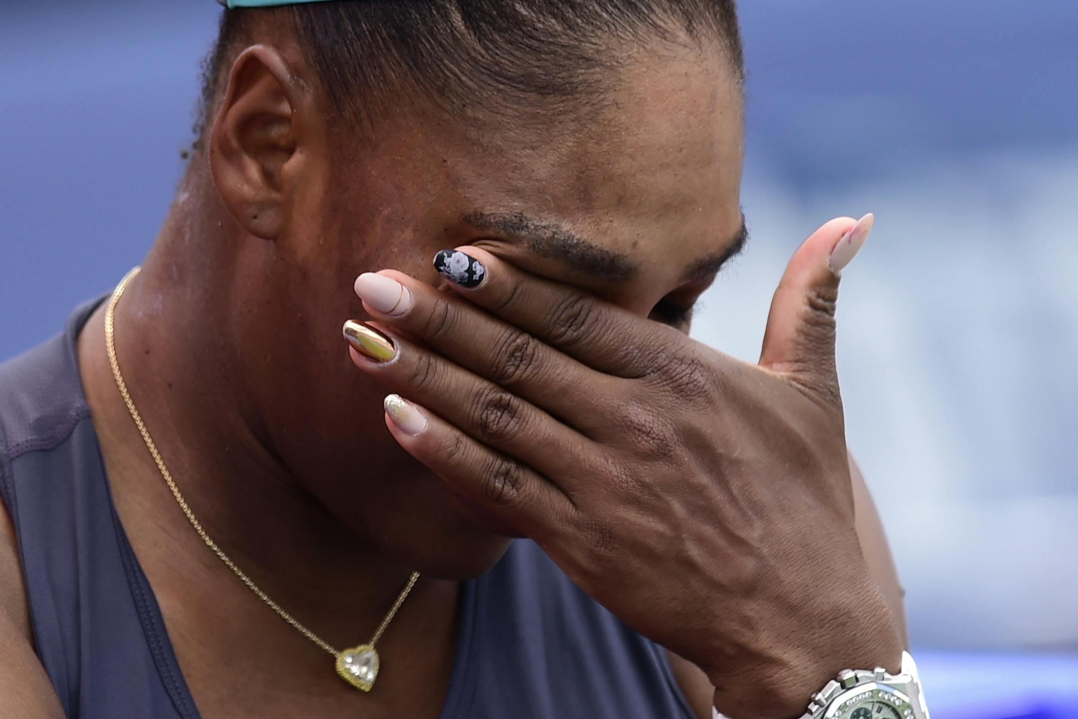 Serena Williams, of the United States, reacts after she had to retire during the final of the Rogers Cup tennis tournament against Canada's Bianca Andreescu in Toronto, Sunday, Aug. 11, 2019. (Frank Gunn/The Canadian Press via AP)