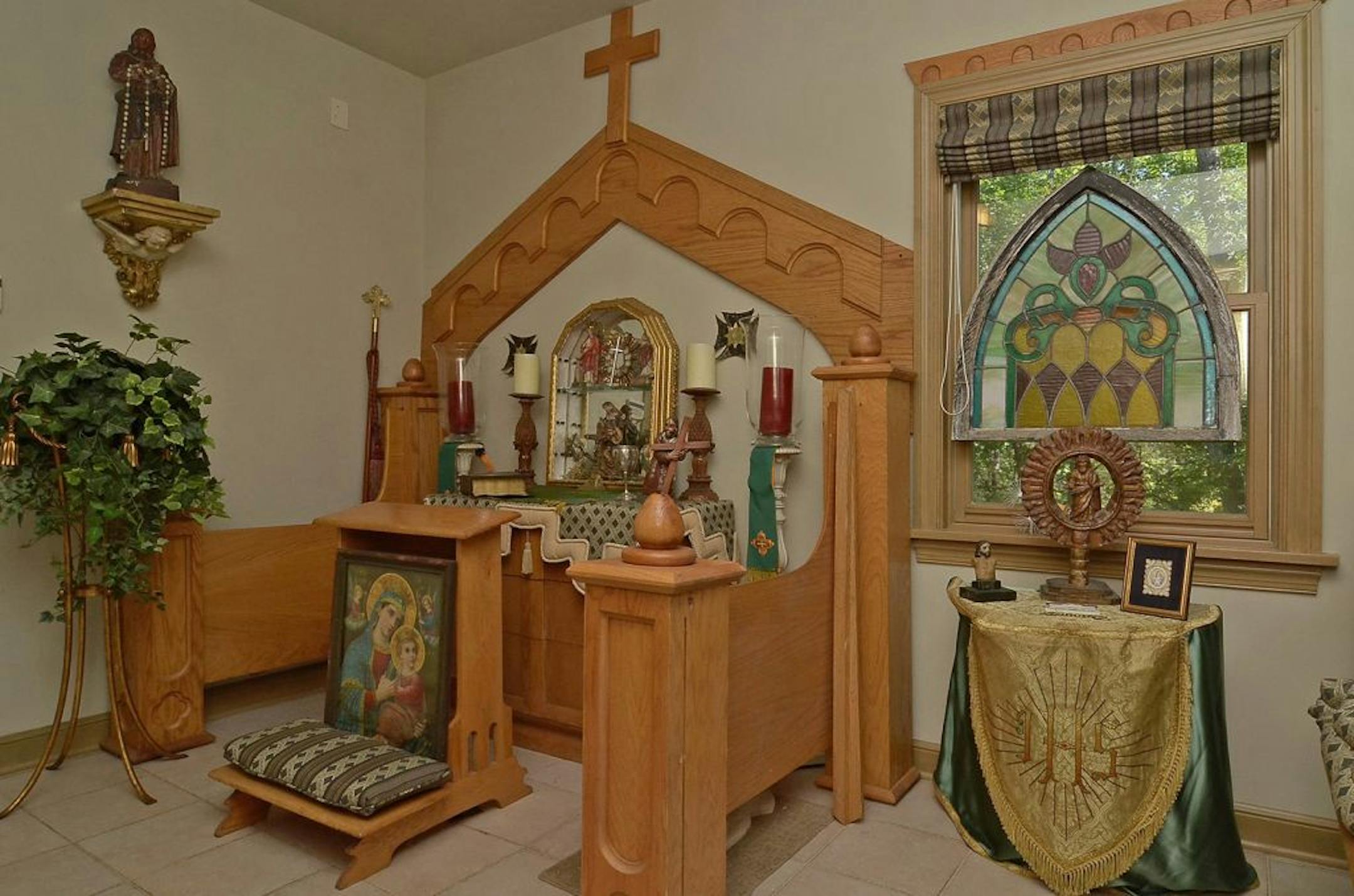A chapel-like room holds the owne'rs collection of religious artifacts.