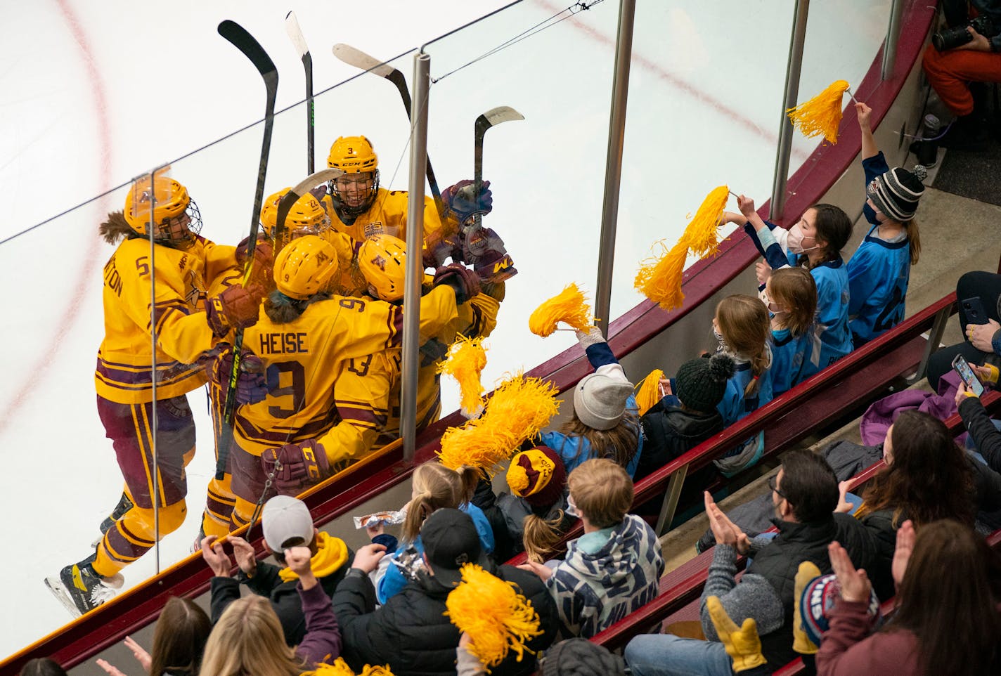 The University of Minnesota women's hockey team celebrates after scoring their first goal of the game against Wisconsin in the first period Saturday, Jan. 22, 2022 in Ridder Arena in Minneapolis, Minn. ]