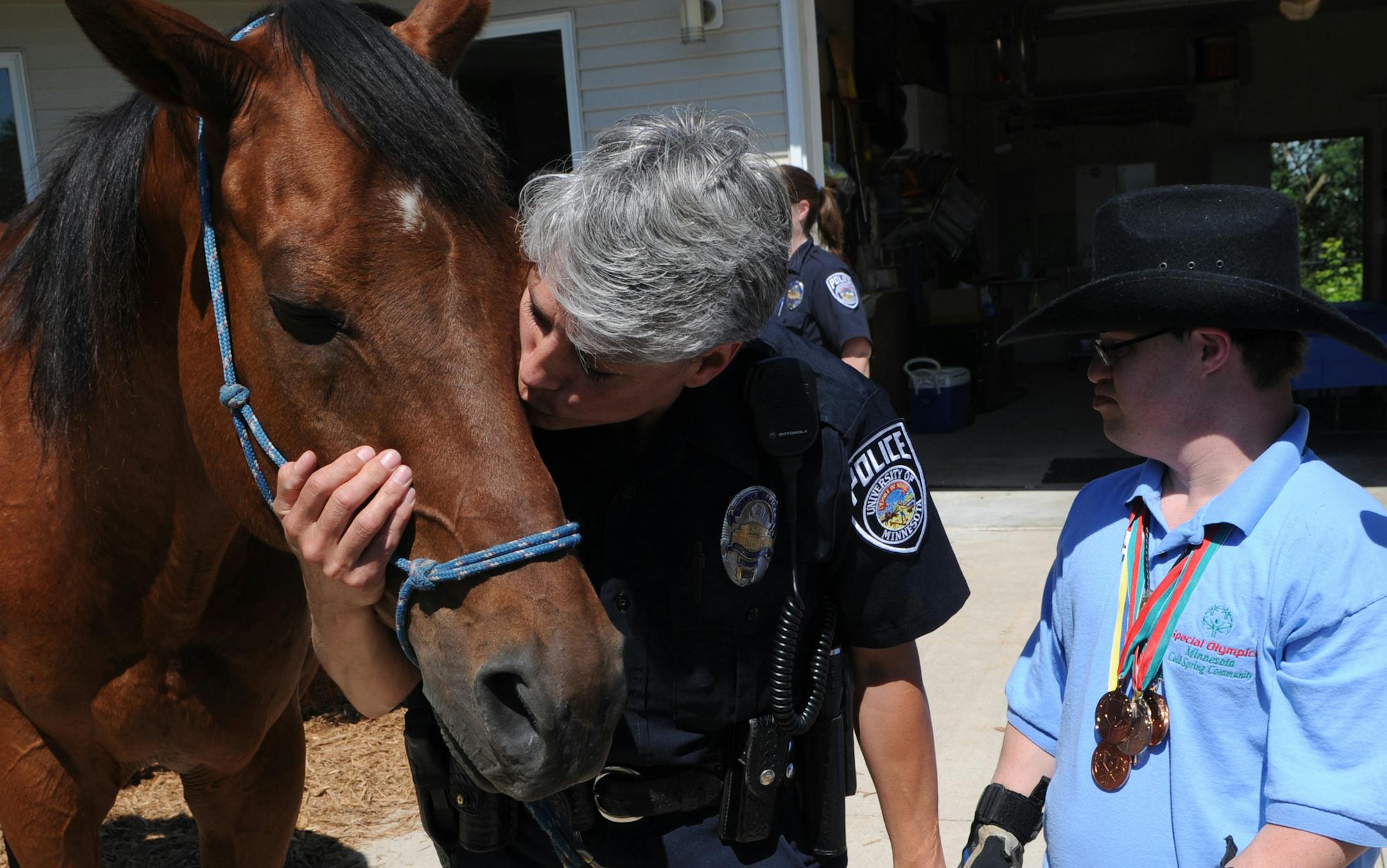 Richard Sennott&#x2022;rsennott@startribune.com] Zimmerman, Mn. Wednesday6/30/10 Whisper, who served as a police horse for 14 years, was retired because of a leg injury suffered in late 2008.Today whisper had a retirement party at his new home on the Decker Farm. Marianne Scheel gave her horse a kiss, she rode the horse for 5 years at the U OF M Police department
