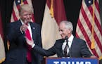 FILE -- Sen. Bob Corker (R-Tenn.), right, introduces Donald Trump, then a candidate for president, at a campaign rally in Raleigh, N.C., on July 5, 20