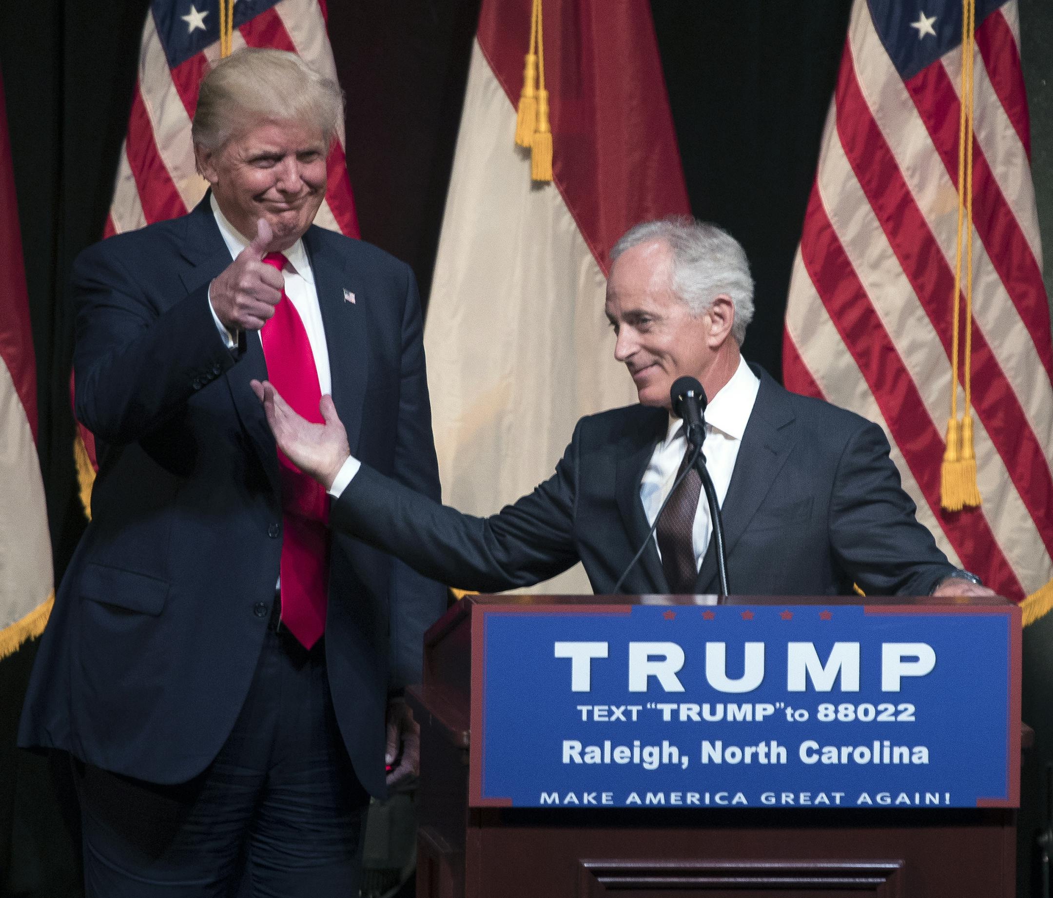 FILE -- Sen. Bob Corker (R-Tenn.), right, introduces Donald Trump, then a candidate for president, at a campaign rally in Raleigh, N.C., on July 5, 2016. Corker, the chairman of the Senate Foreign Relations Committee, charged in an interview on Sunday, Oct. 8, 2017, that President Trump was treating his office like “a reality show,” with reckless threats toward other countries that could set the nation “on the path to World War III.” (Stephen Crowley/The New York Time