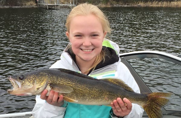 Caroline Scheldrup, 12, of Plymouth, with a 24-inch walleye she caught on Mother's Day at Lake Vermilion.