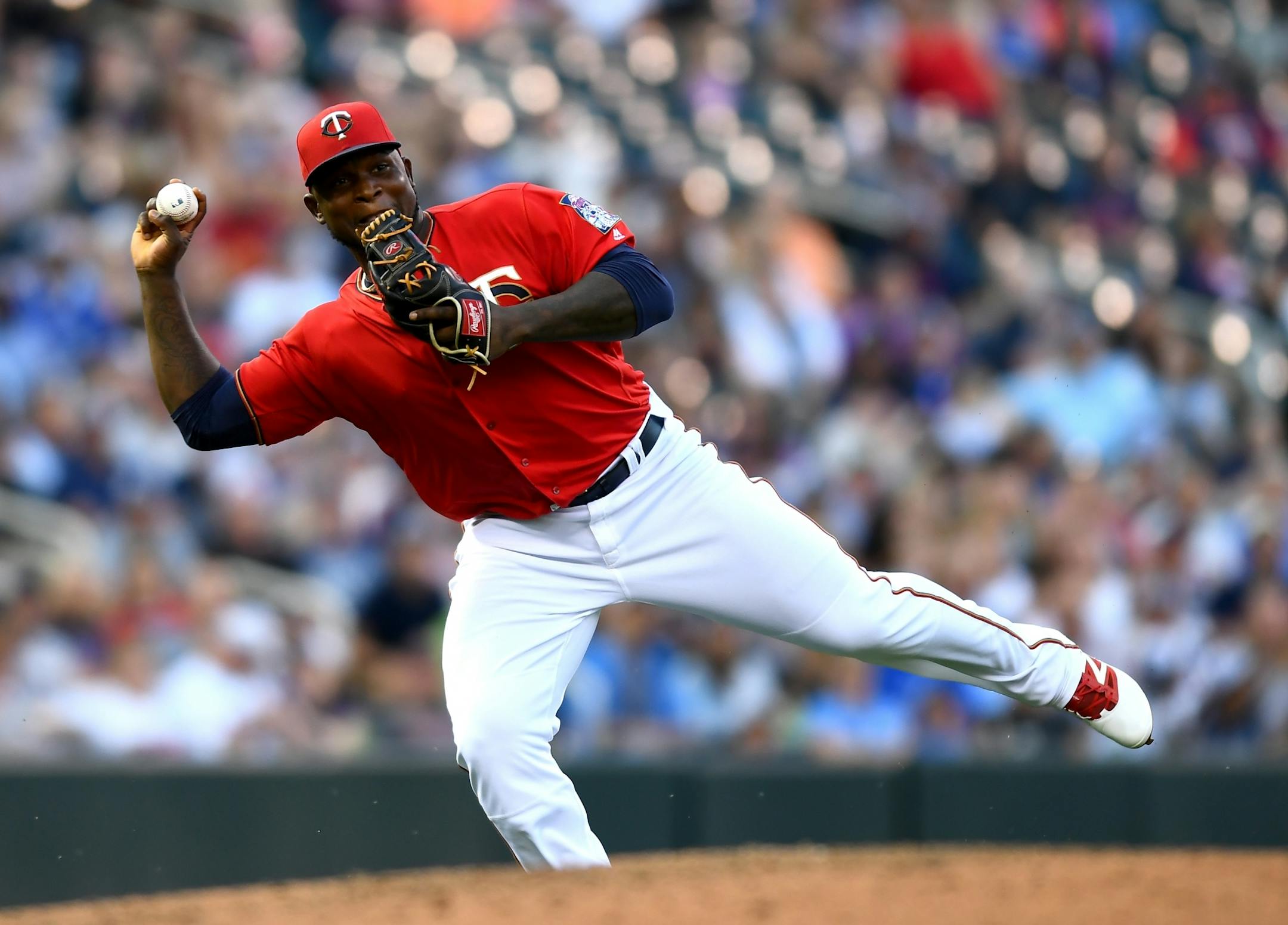 Minnesota Twins third baseman Miguel Sano (22) committed a throwing error to first after a single was hit his way by Cleveland Indians first baseman Mike Napoli (26) in the top of the 4th inning Friday night.