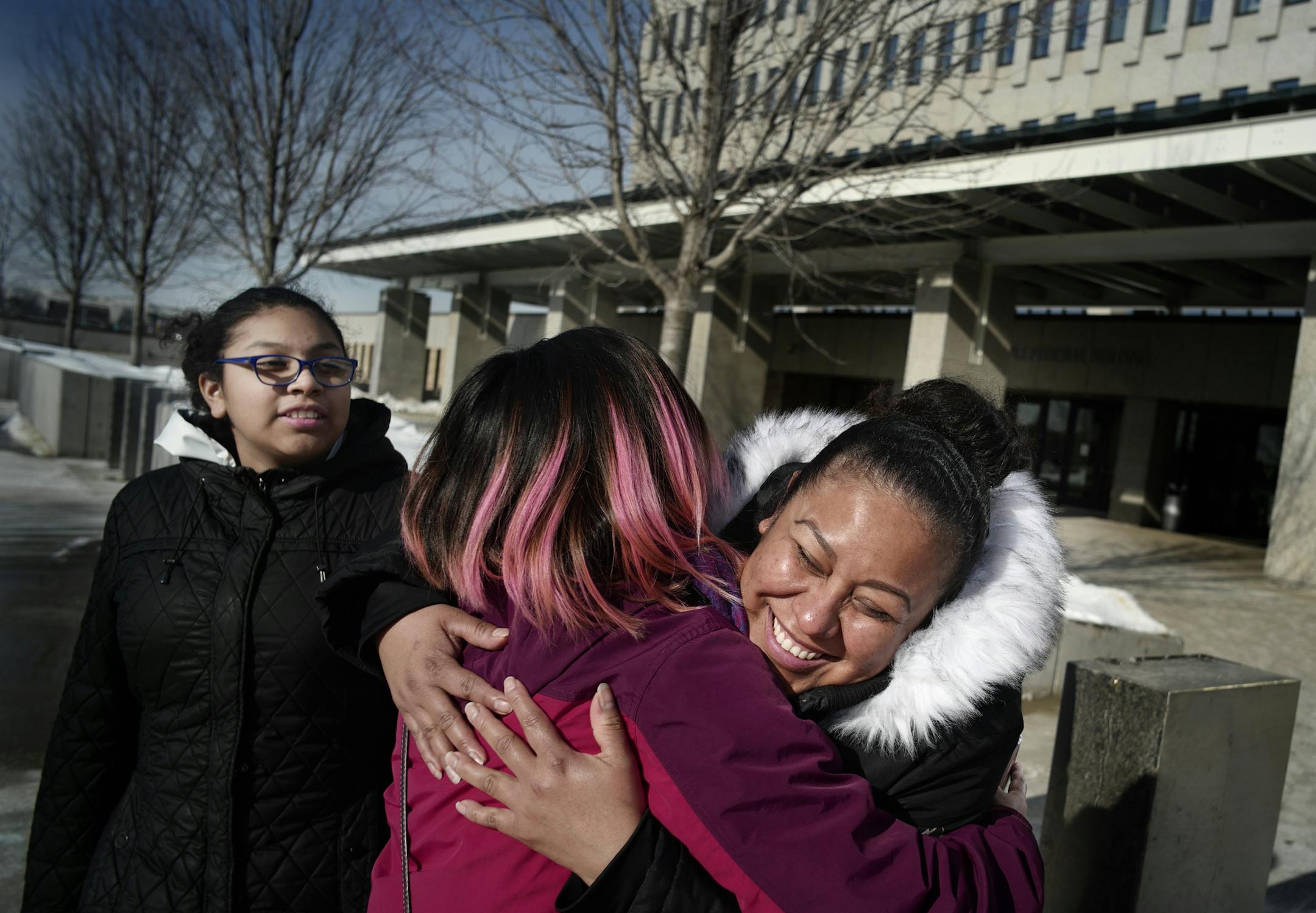Sandra Gonzaga hugged family friend Gladys Marcial, with daughter Paola,12,on the left. The Gonzaga family emerged from Federal Court optimistic that Gonzaga's husband might be released on bond in the next court hearing on Monday.]n January, Sandra Gonzaga was featured in a Star Tribune story about a state human rights complaint she filed against her trailer park's management, including an allegation that a manager had reported residents to immigration authorities. The following week, ICE came t