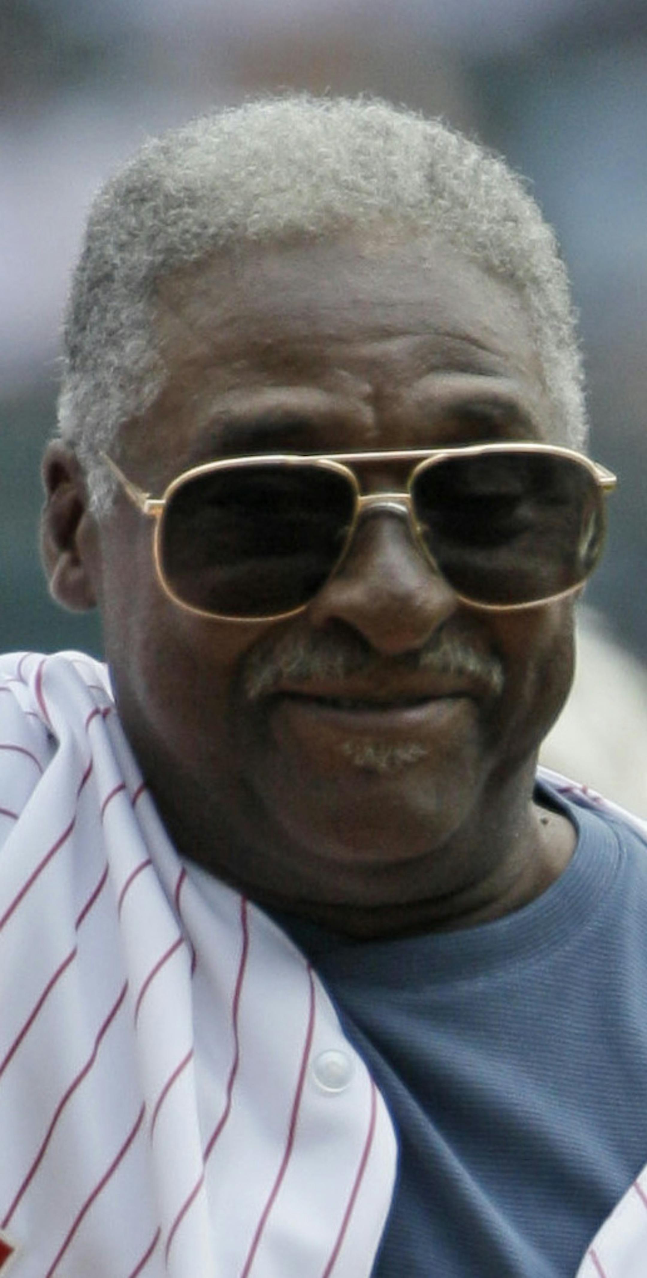 Former Chicago White Sox's Dick Allen waves before throwing out a ceremonial first pitch before an interleague baseball game against the Milwaukee Brewers in Chicago, Sunday, June 24, 2012. (AP Photo/Nam Y. Huh) ORG XMIT: CXS110