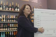 State Auditor Julie Blaha presents her office’s annual audit of municipal liquor store sales Thursday.