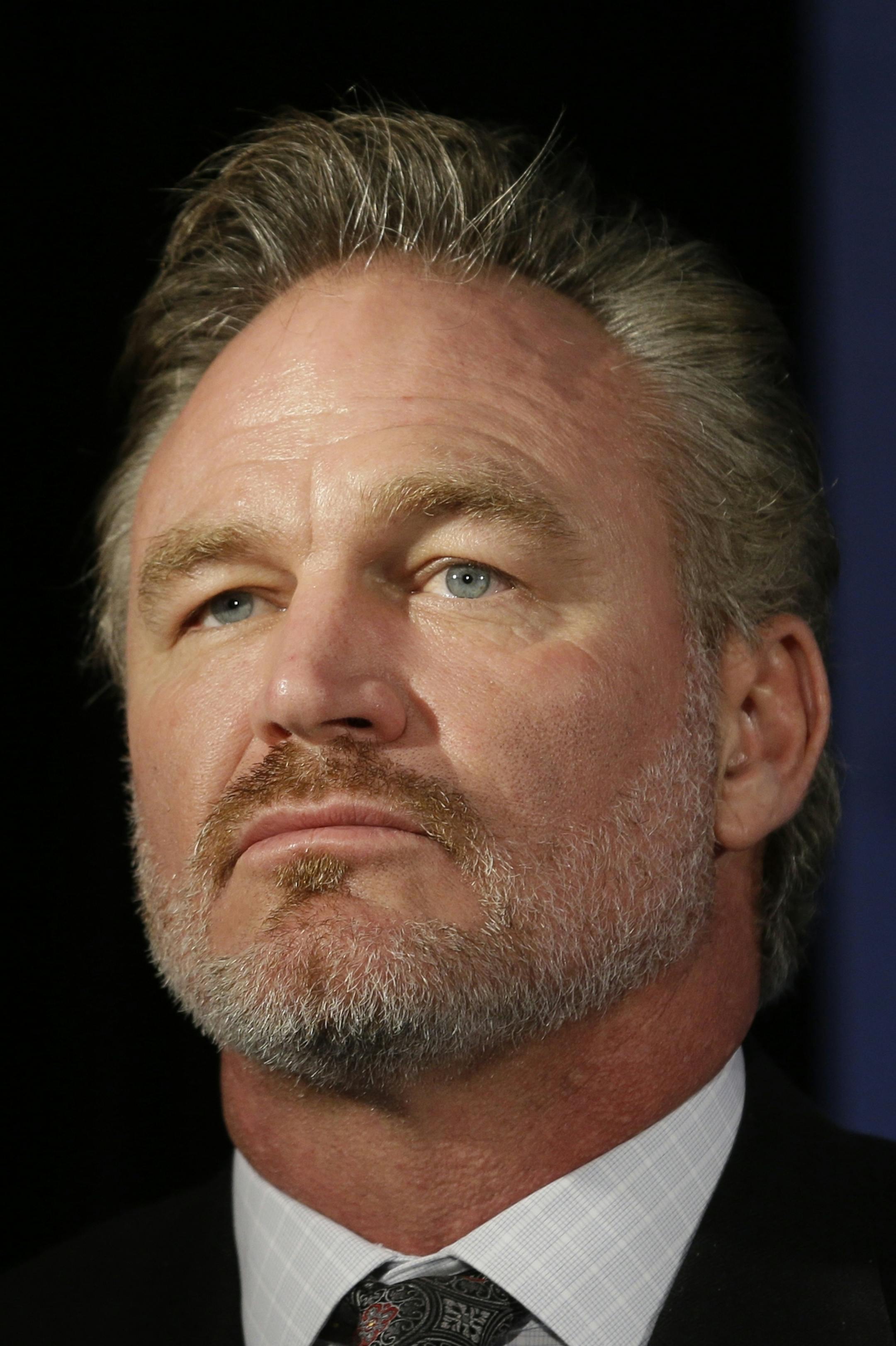 FILE - In this Jan. 9, 2015, file photo, former Oklahoma linebacker Brian Bosworth listens during a news conference announcing the 2015 College Football Hall of Fame Class, in Dallas. Bosworth's College Football Hall of Fame induction was a milestone that marked a turning point in the life of the former Oklahoma linebacker known as the Boz. (AP Photo/LM Otero, File)