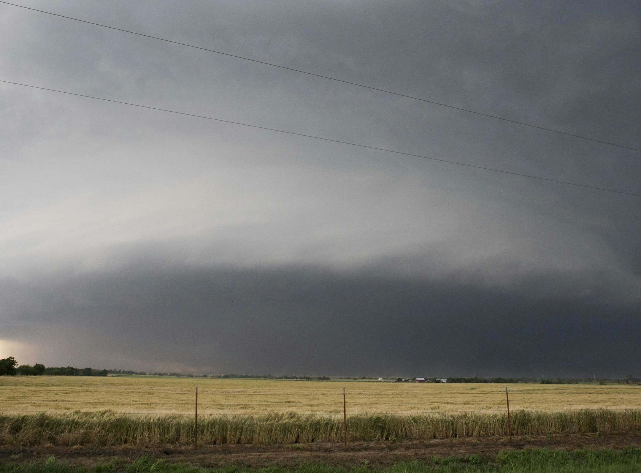 FILE - In this May 31, 2013 file photo a tornado forms near Banner Road and Praire Circle in El Reno, Okla. The National Weather Service says the deadly tornado that struck near Oklahoma City late last week was another top-of-the-scale EF5 that packed winds reaching 295 mph. The weather service also says the twister's 2.6-mile width is the widest ever recorded. (AP Photo/Alonzo Adams, File)