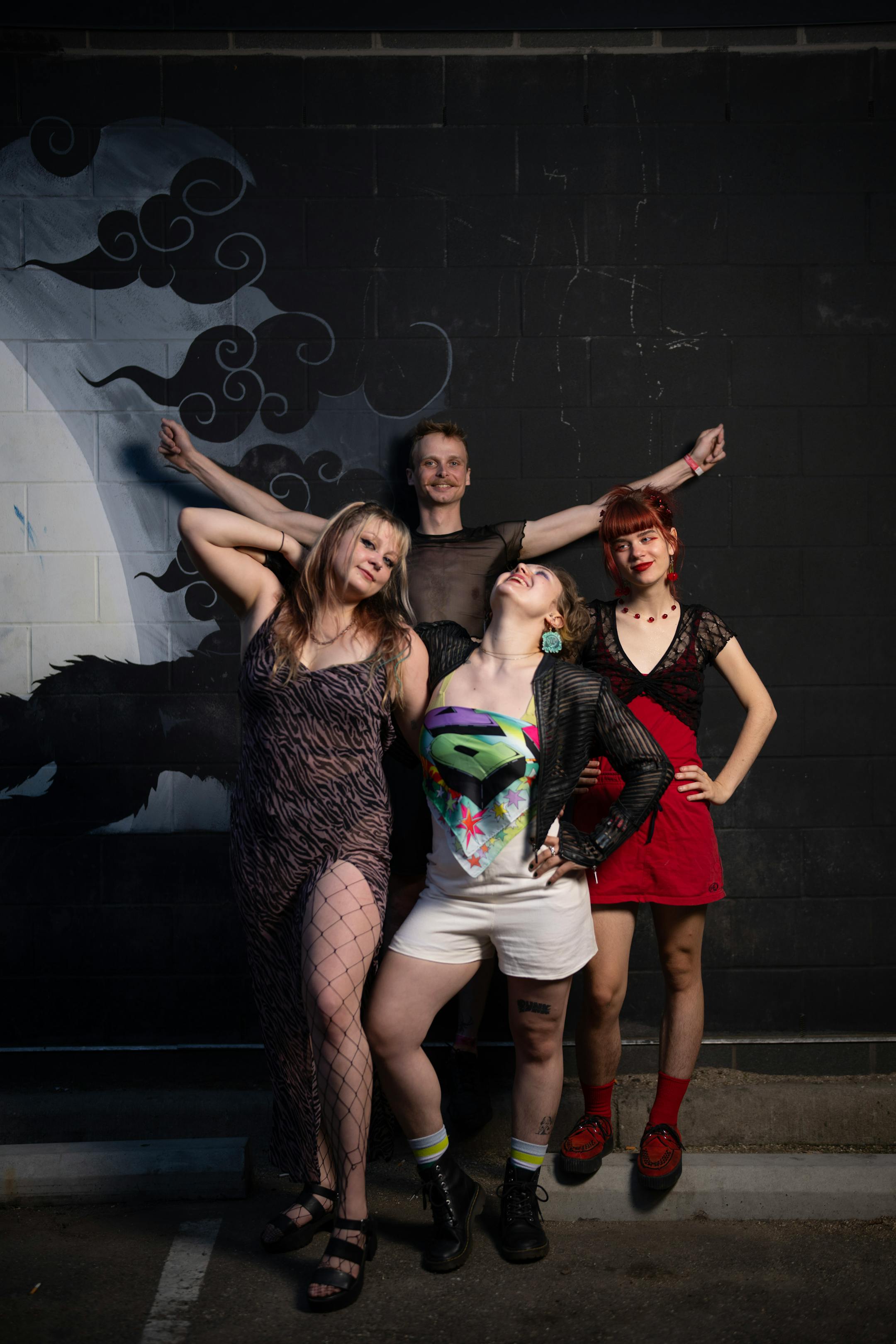 Surly Grrly assembled for a portrait before their show at Mortimer's in Minneapolis Wednesday night, June 7, 2023. They are, from left, Medbh McNamara, Peter Korhonen, Eloise Boigenzahn, and Lou Levy. Minneapolis power-punk trio Surly Grrly is leading the "It Smells Like Queer in Here" residency series at Mortimer's in June with fellow queer punk groups, part of a long string of shows by these rowdy and fun envelope-pushers. ] JEFF WHEELER • jeff.wheeler@startribune.com