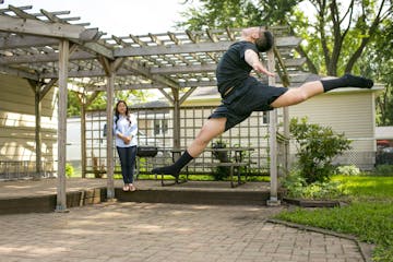 Dmitri Moua of Roseville practices in his back yard while his mom Boa watches. loves to dance and is on his school's dance team in Minnesota. Moua isn