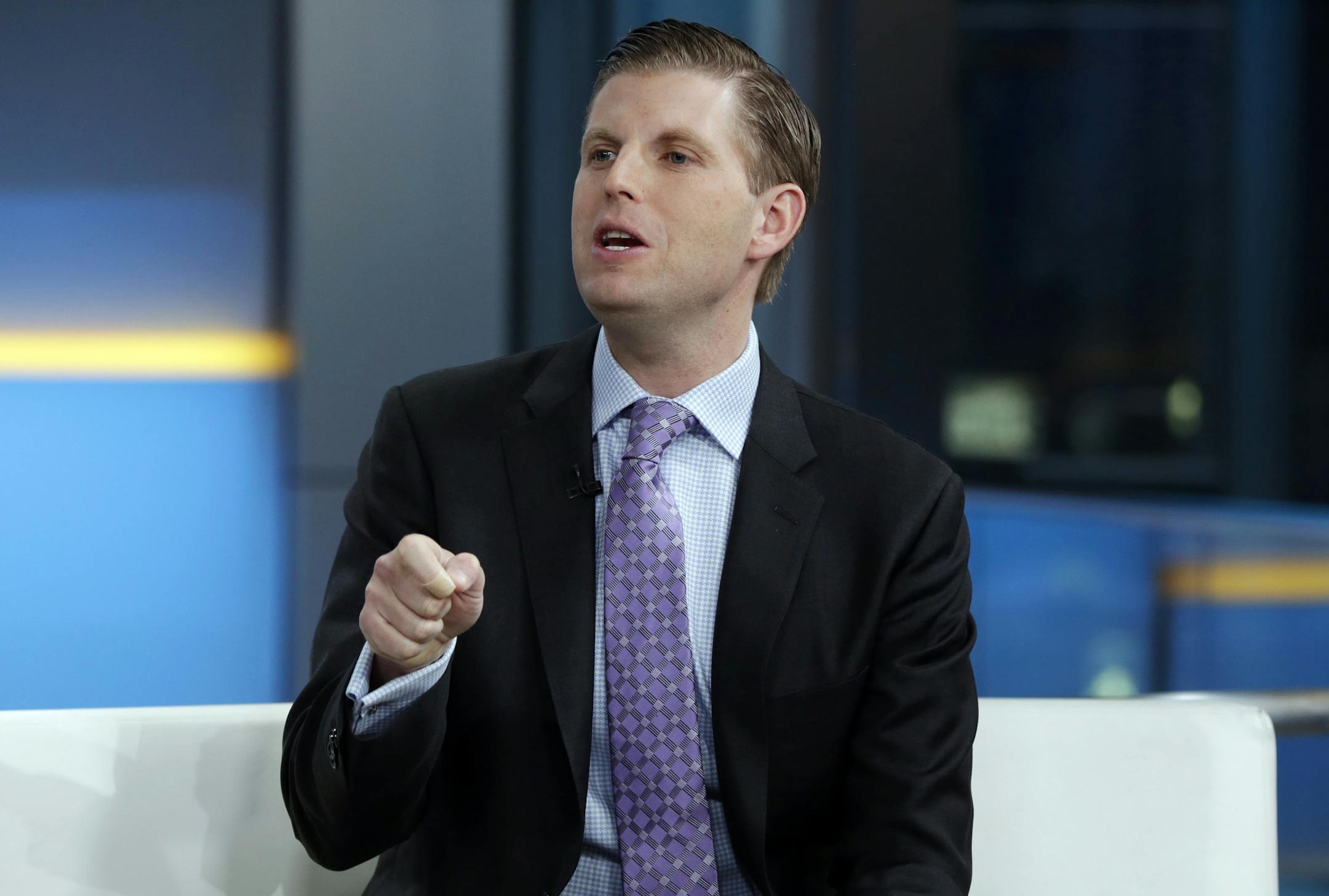FILE - In this Jan. 17, 2018 file photo, Eric Trump appears on the "Fox & friends" television program, in New York. Trump says the U.S. Secret Service took an employee of a Chicago cocktail lounge into custody Tuesday, June 25, 2019, after she spit on him. Chicago police say they assisted the Secret Service at the scene. (AP Photo/Richard Drew, File)