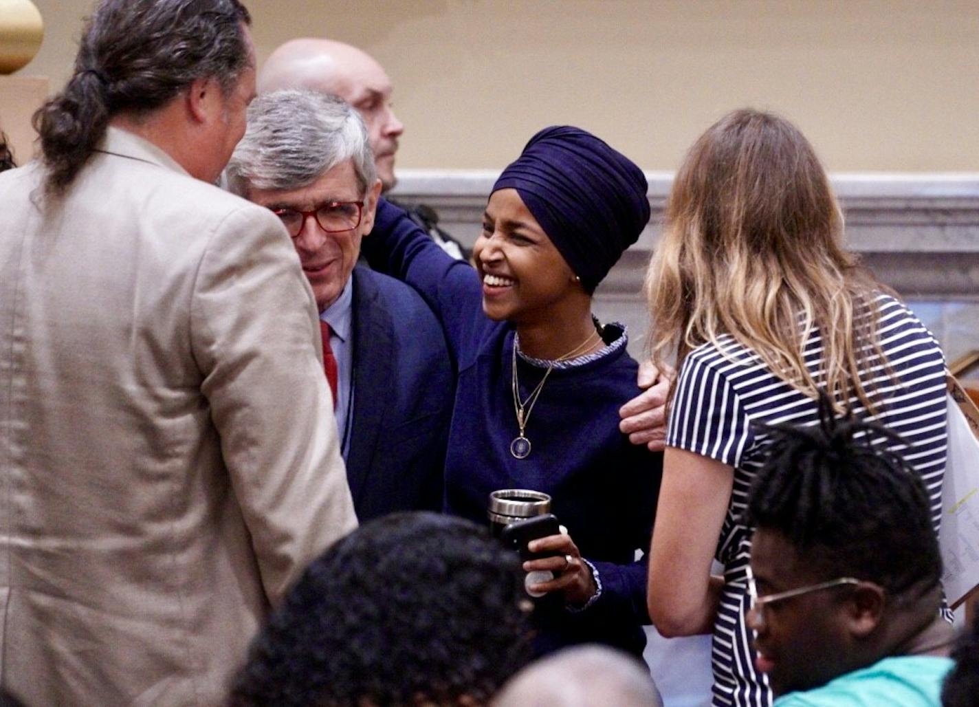 U.S. Rep. Ilhan Omar chatted with others Thursday at Minneapolis City Hall for Mayor Jacob Frey's budget address.