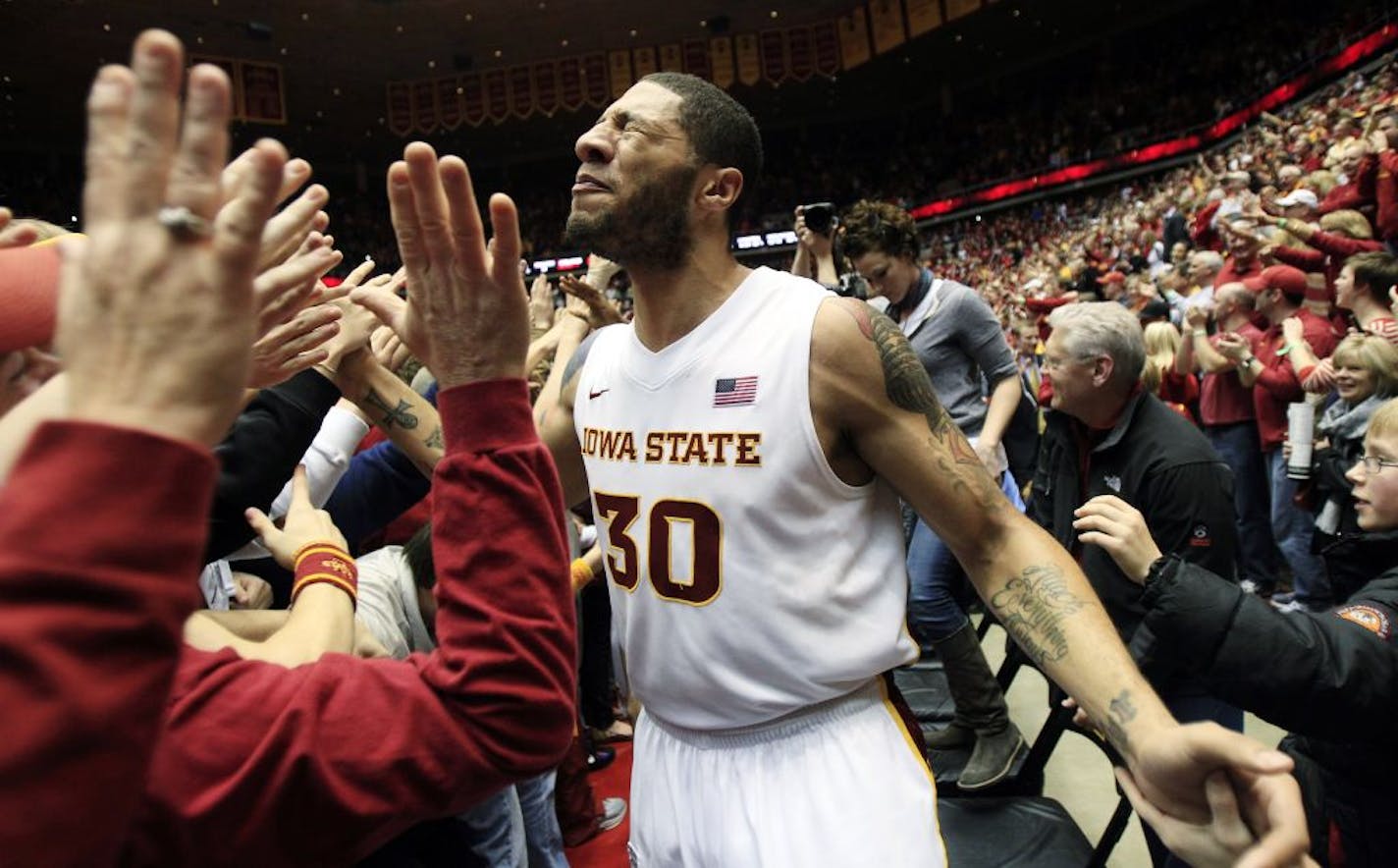 Iowa State forward Royce White celebrates with fans after his team's 80-72 victory over Baylor in an NCAA college basketball game, Saturday, March 3, 2012, in Ames, Iowa.