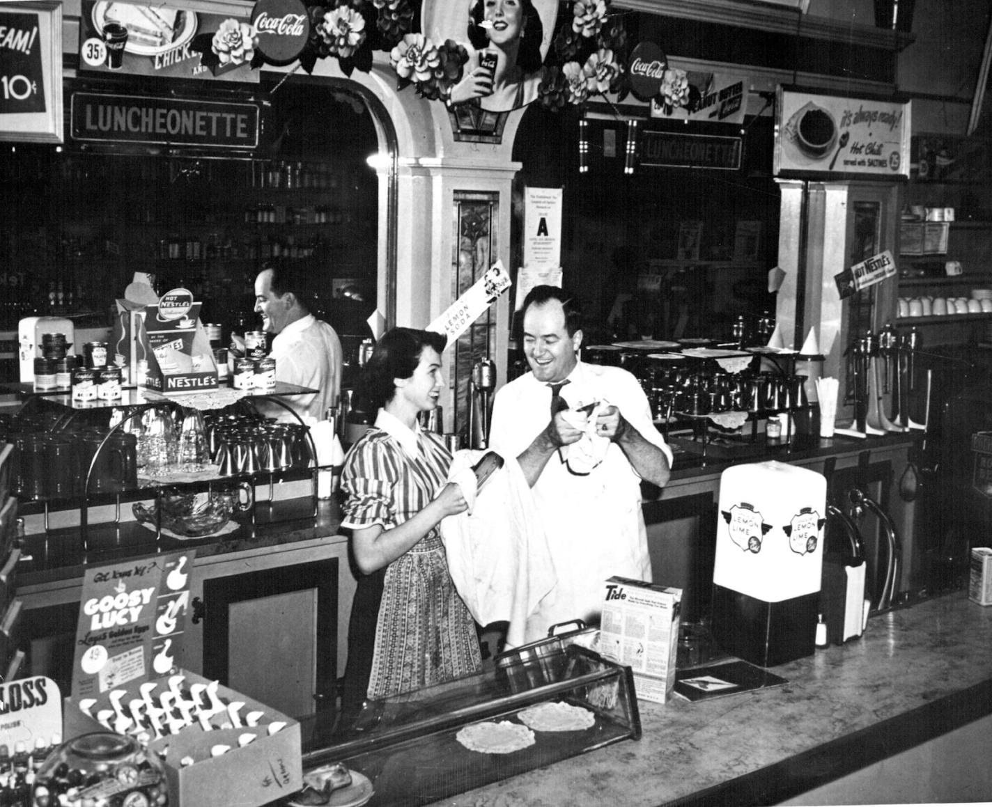 December 13, 1949 Humphrey at his family's drugstore in Huron, SD. Senator Turns Druggist -- A graduate pharmacist, U.S. Senator Hubert B. Humphrey of Minnesota is helping in the family's-drug store in Huron during the recess of Congress. Humphrey, who worked in the pharmacy until he went back to school for his B.A. degree at the University of Minnesota in 1939, is still a partner in the firm. He returned to Huron to help get the family affairs settled after the death of his father, Humphrey, Sr