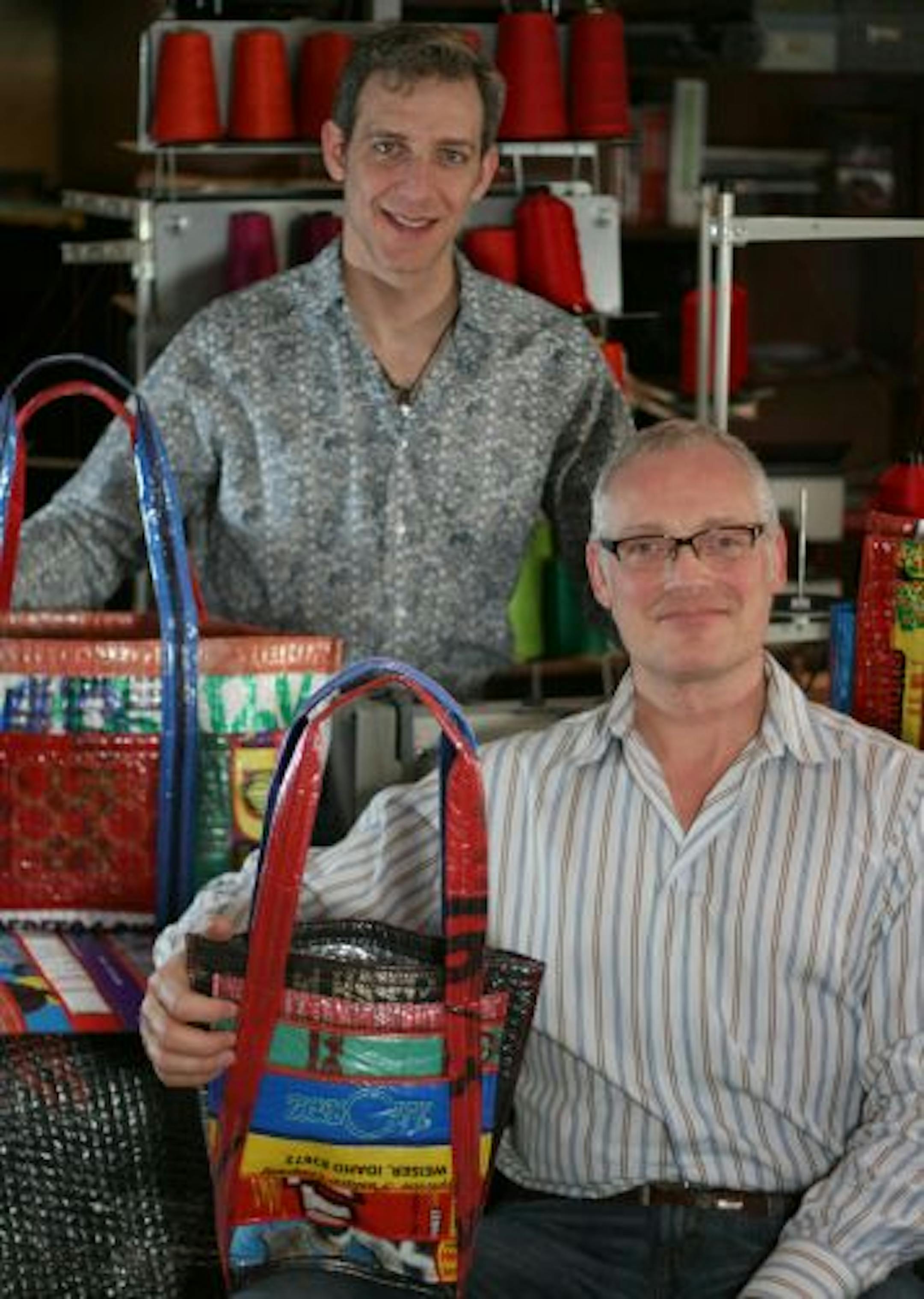 Chad Campbell (left) and Paul Hempe (right) are the co-owners of ZerOw Bags, a local business that creates bags out of recycled plastics. They design various styles of bags (such as shopping bags, messenger bags, and hand bags) using materials donated from a grocery store and a local metalized balloon business. ZerOw Bags was created in August 2008 and is run out of Hempe's basement.
