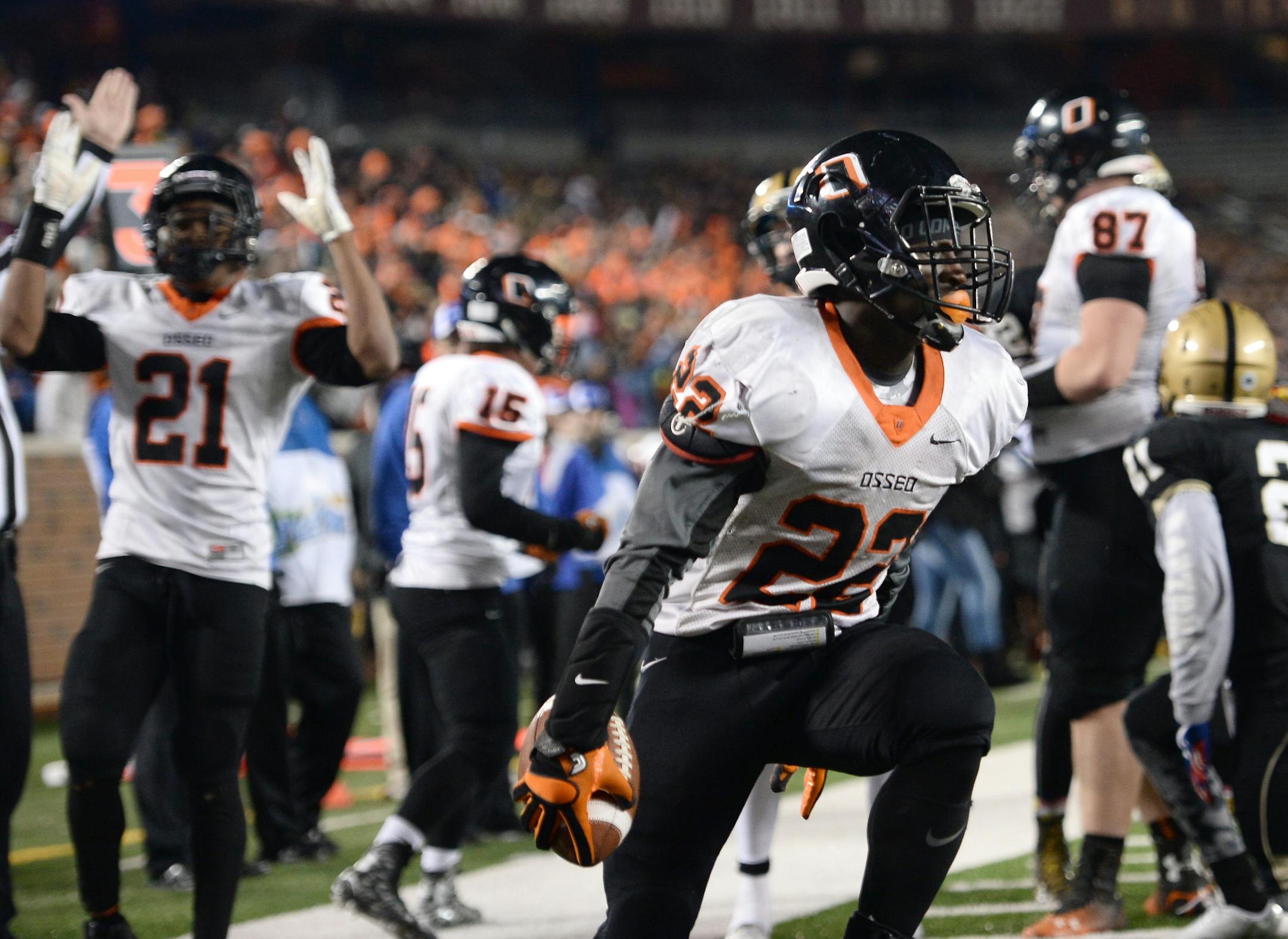 Osseo running back Prince Kruah (22) celebrated his game-tying touchdown in the final minute of his team's 6A championship game against East Ridge. ] (AARON LAVINSKY/STAR TRIBUNE) aaron.lavinsky@startribune.com Osseo played East Ridge in the Class 6A championship game on Friday, Nov. 13, 2015 at TCF Bank Stadium.