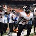 Osseo running back Prince Kruah (22) celebrated his game-tying touchdown in the final minute of his team's 6A championship game against East Ridge. ] 