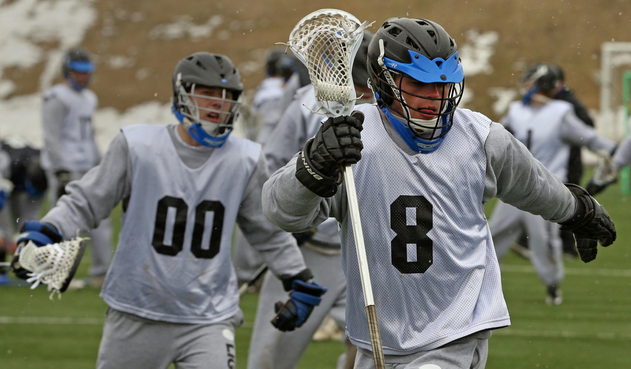 Ryan McNamara, right, and the Eastview lacrosse team ran drills at McMurray Fields in St. Paul. Star Tribune photo: Bruce Bisping * bbisping@startribune.com