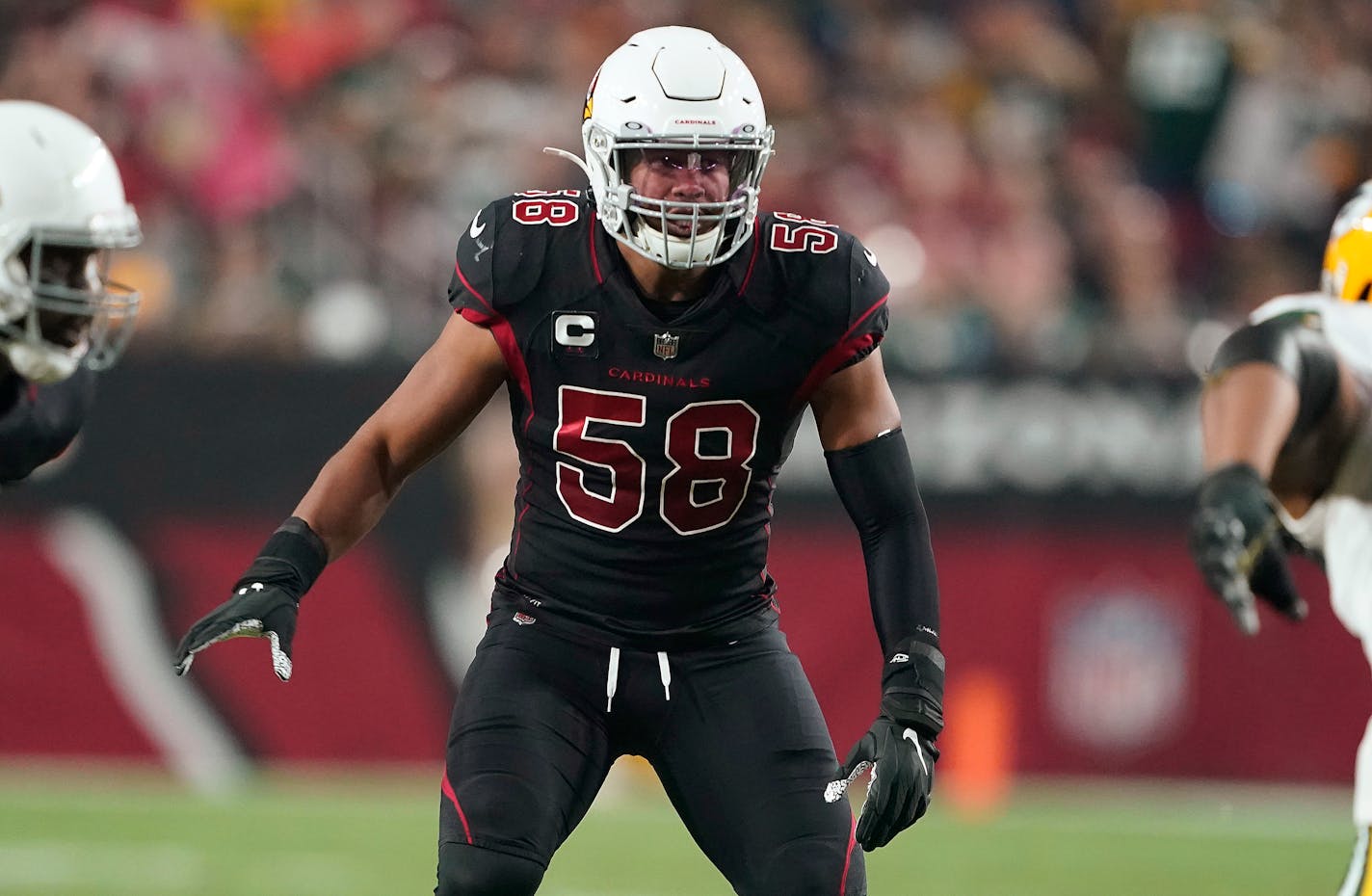 FILE - Arizona Cardinals linebacker Jordan Hicks (58) watches a play begin during the team's NFL football game against the Green Bay Packers on Oct. 28, 2021, in Glendale, Ariz. The Minnesota Vikings have agreed to terms on a two-year, $12 million contract with Hicks. Hicks spent the last three seasons with Arizona. He has started 51 straight games. That is the third-longest active streak by NFL linebackers. (AP Photo/Darryl Webb, File)