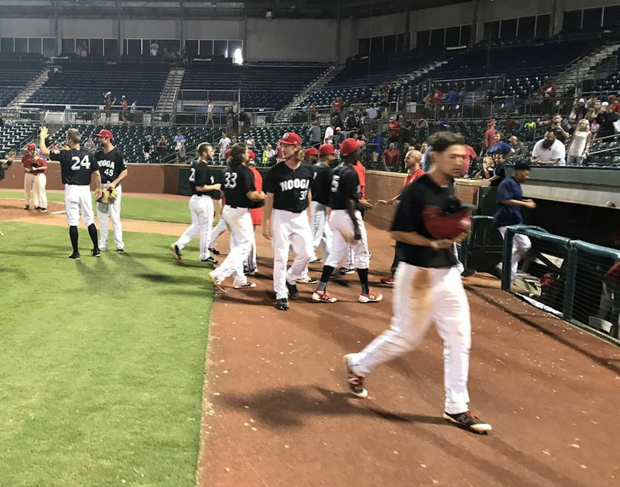 Members of the Chattanooga Lookouts celebrate their 21-inning victory Sunday. Photo courtesy of the Chattanooga Lookouts.