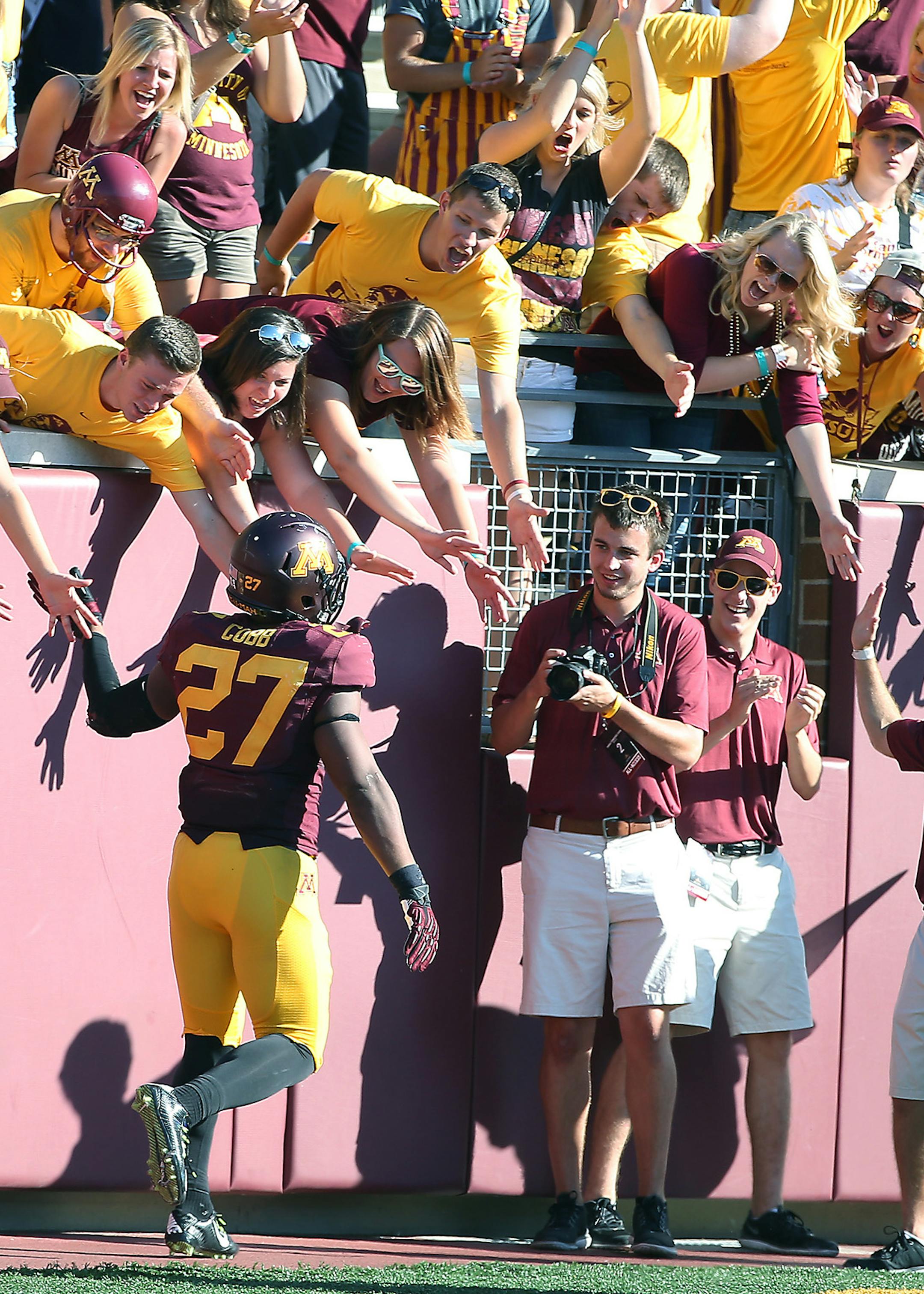 Minnesota senior running back David Cobb celebrated with fans after he ran for 48 yards for a touchdown in the third quarter as the Minnesota Gophers took on Middle Tennessee at TCF Bank Stadium, Saturday, September 6, 2014 in Minneapolis, MN. ] (ELIZABETH FLORES/STAR TRIBUNE) ELIZABETH FLORES • eflores@startribune.com