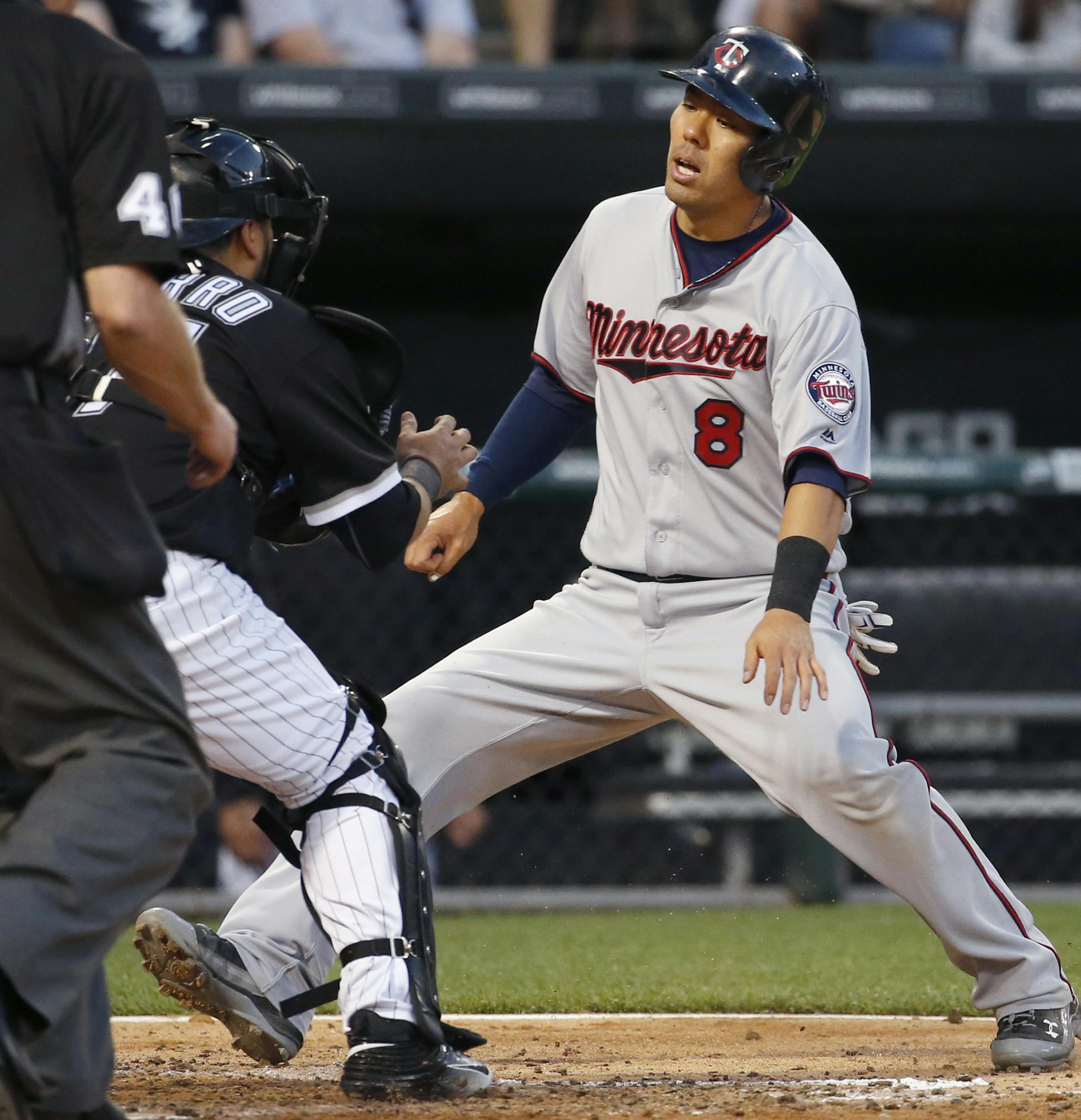 Minnesota Twins' Kurt Suzuki, right, is tagged out by Chicago White Sox catcher Dioner Navarro during the fifth inning of a baseball game in Chicago, Wednesday, June 29, 2016. (AP Photo/Nam Y. Huh)