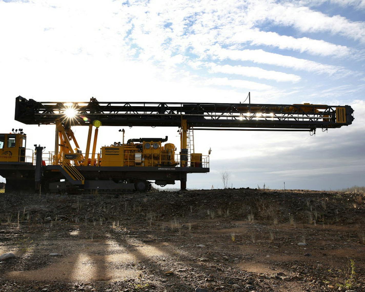 An Atlas Copco pit viper drill sits on the site of Essar Steel Minnesota's taconite mine project in Nashwauk, Minn. ] LEILA NAVIDI leila.navidi@startribune.com / BACKGROUND INFORMATION: Thursday, October 30, 2014. Essar Steel Minnesota recently ramped up construction on an $1.8 billion taconite plant after securing the funding needed to complete the project. The plant endured several delays over the past two years as funds periodically ran dry and some contractors were paid late and walked off t