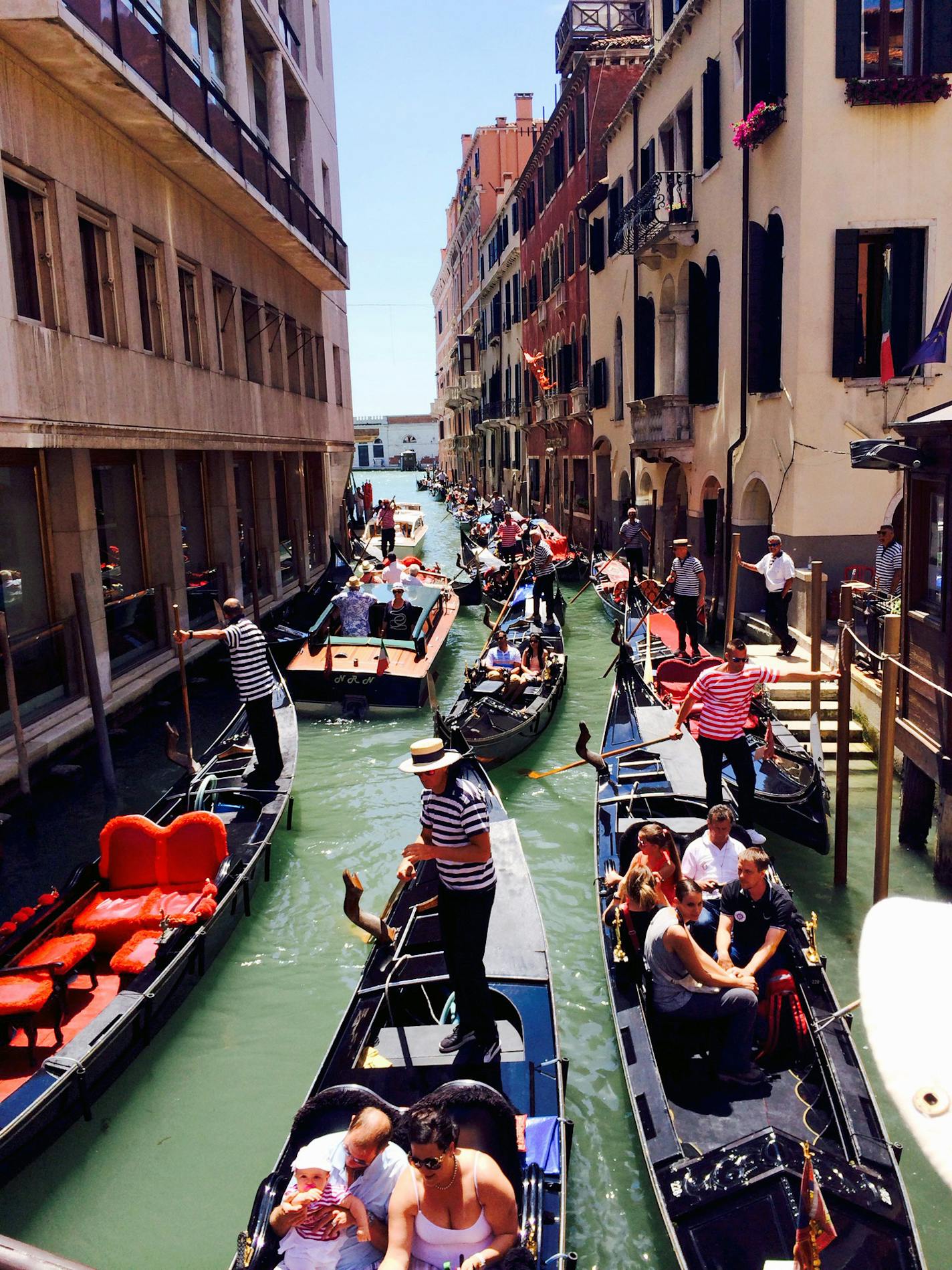 Venice version of rush hour, as gondola drivers jockey for position in a crowded canal.