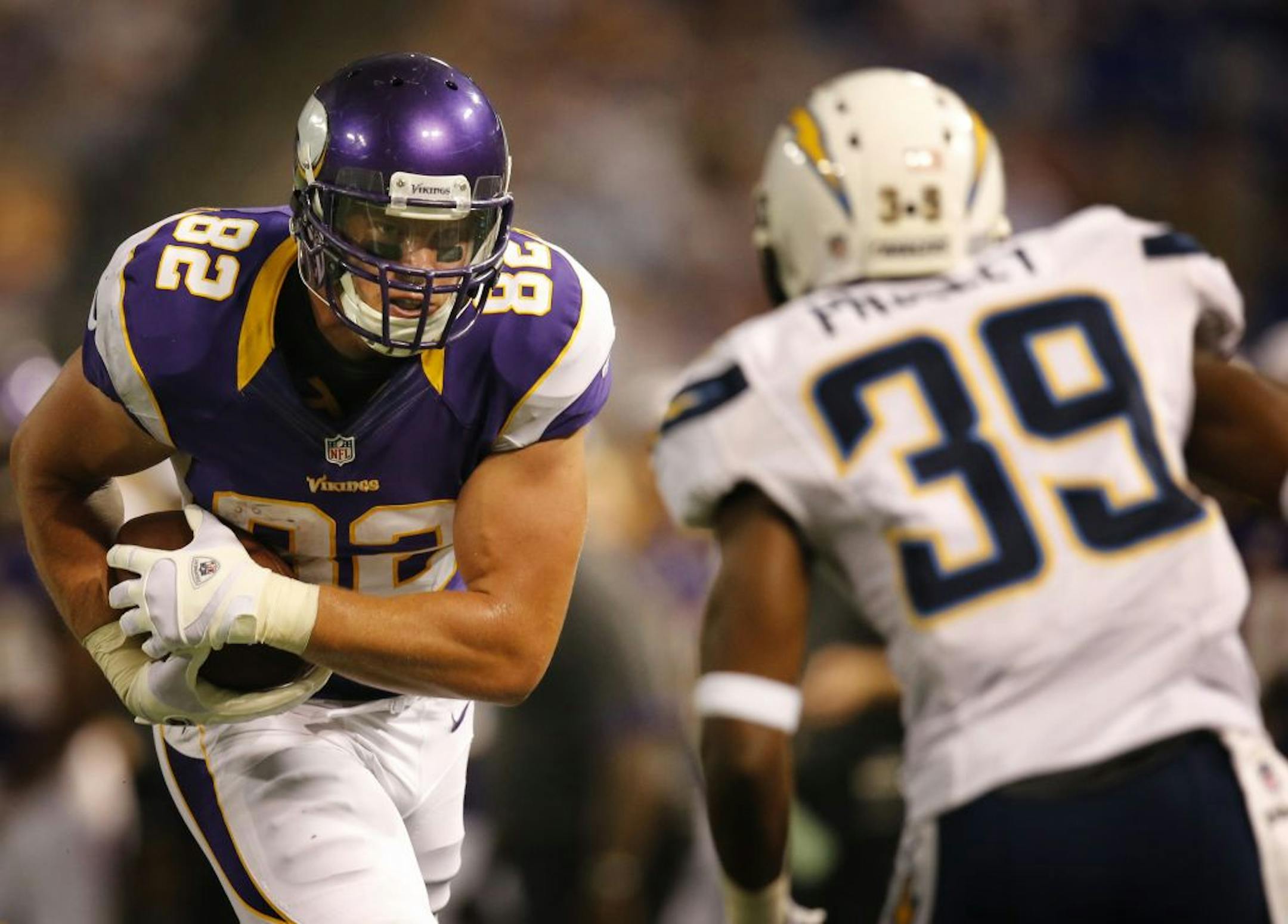 Minnesota Vikings tight end Kyle Rudolph (82) was tackled by San Diego Chargers defensive back Presley (39)during NFL preseason action between the Minnesota Vikings and the San Diego Chargers in Minneapolis , Minnesota Thursday August 23, 2012. San Diego beat Minnesota 12-10.