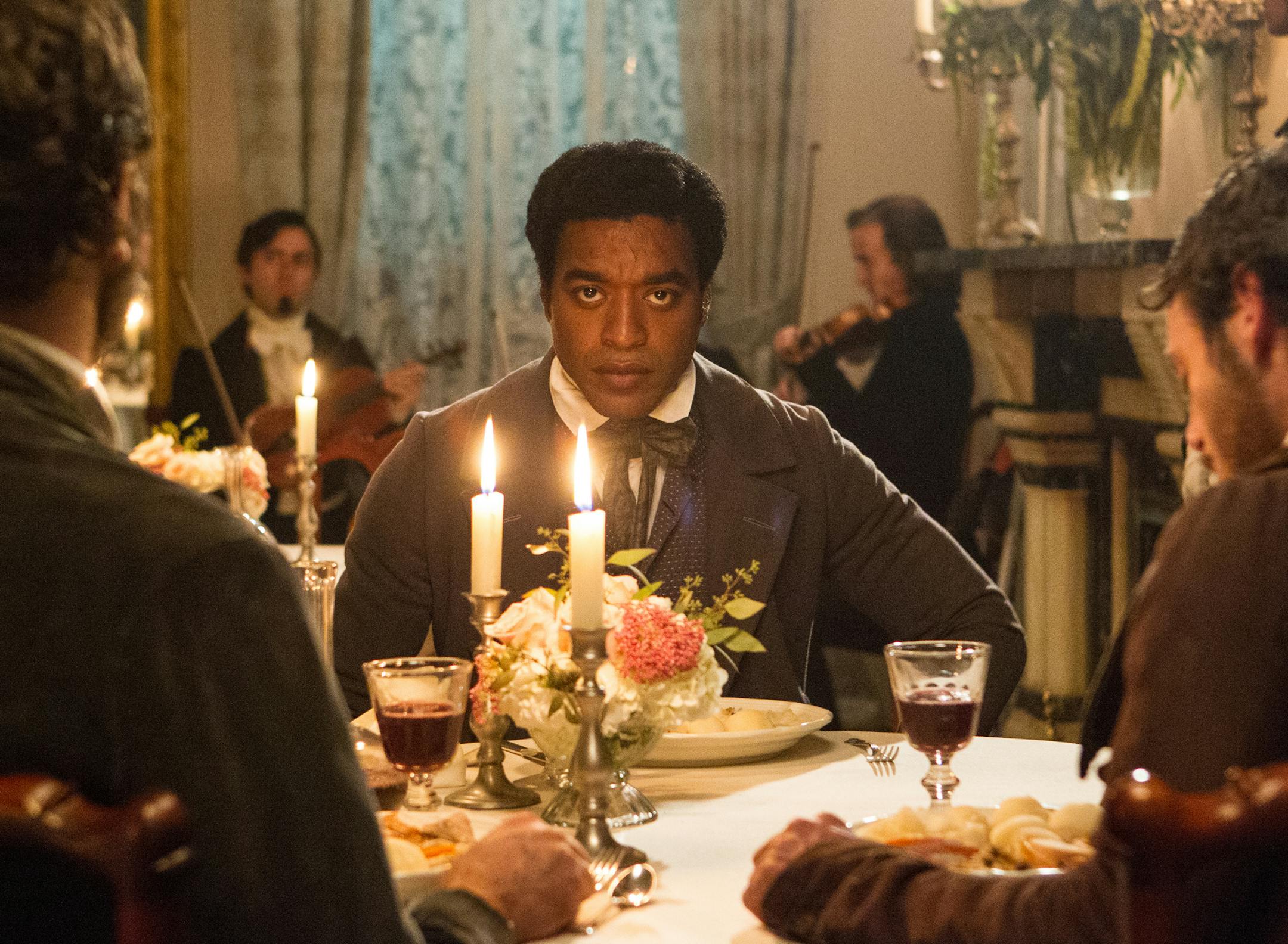 This film publicity image released by Fox Searchlight shows Chiwetel Ejiofor in a scene from "12 Years A Slave." Steve McQueenís historic saga ì12 Years a Slave,î Jon Wellsí dysfunctional family adaptation ìAugust: Osage County, Jean-Marc Valleeís early AIDS epidemic drama ìDallas Buyers Clubî the White House servant tale ìLee Danielís The Butlerî top the list of outstanding performances for the 20th annual Screen Actors Guild Awards with th
