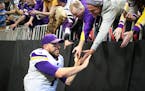Vikings quarterback Case Keenum celebrated with fans after beating the Falcons 14-9 at Mercedes-Benz Stadium