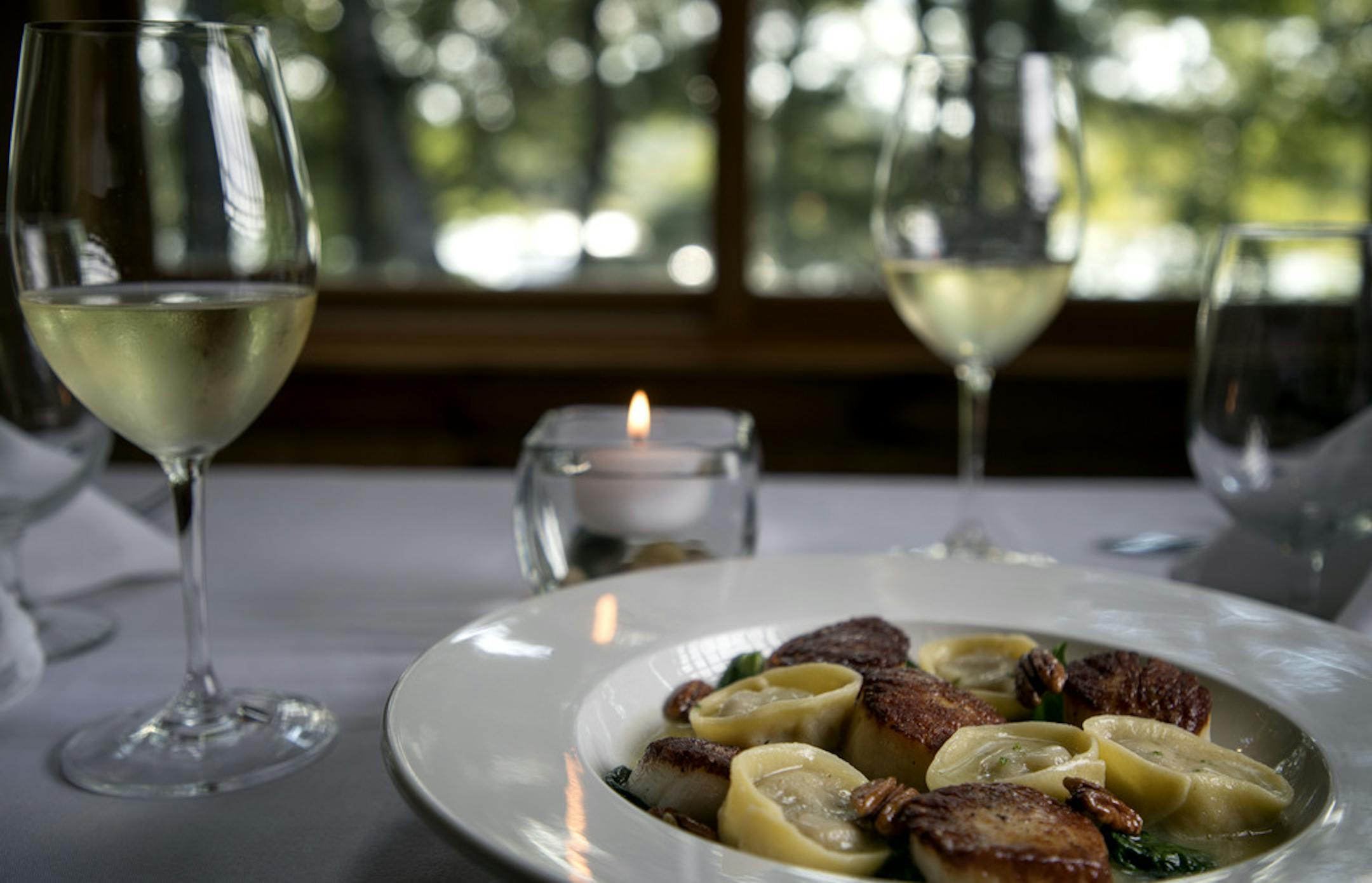 Stuffed Tortellini, butternut squash stuffed hand-made tortellini's served with seared diver scallops, creamy butter sauces and topped with candied pecans at Lost Lake Lodge Sunday September 3,2018 in Nisswa, MN. ] JERRY HOLT &#x2022; jerry.holt@startribune.com