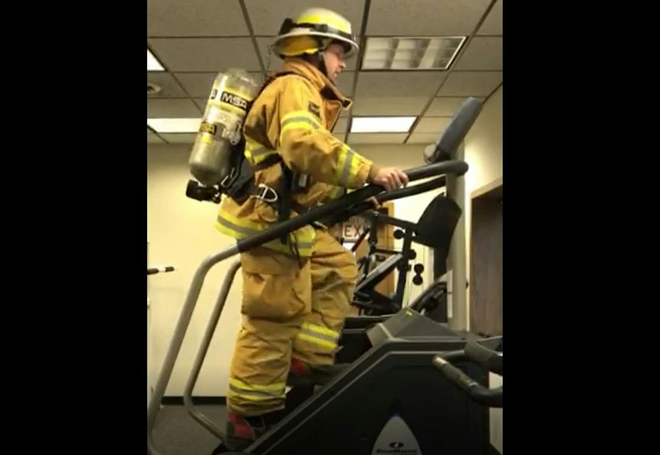 Jesse Messner, of Brownton, Minn., strapped on 45 pounds of gear before going 110 stories on a stair climber. Credit: Provided by Jesse Messner