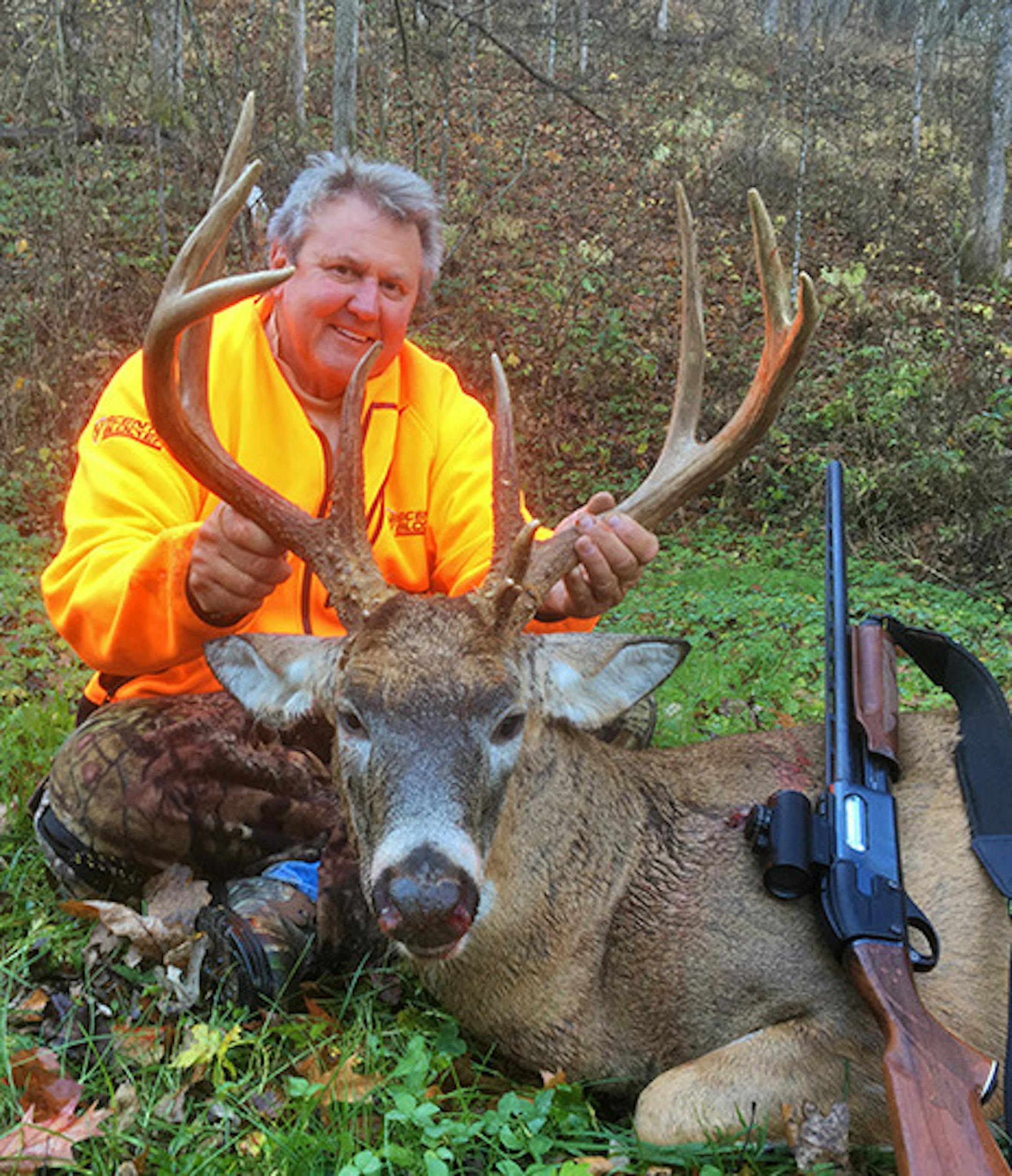 George Groff of Rosemount with the buck he shot on private land in Fillmore County with his 20 gauge shotgun on the opening day of the Minnesota firearms deer season
