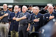 Medal of Honor recipients placed their hands over their hearts during the National Anthem. Over 30 Medal of Honor recipients gathered at U.S. Bank Sta